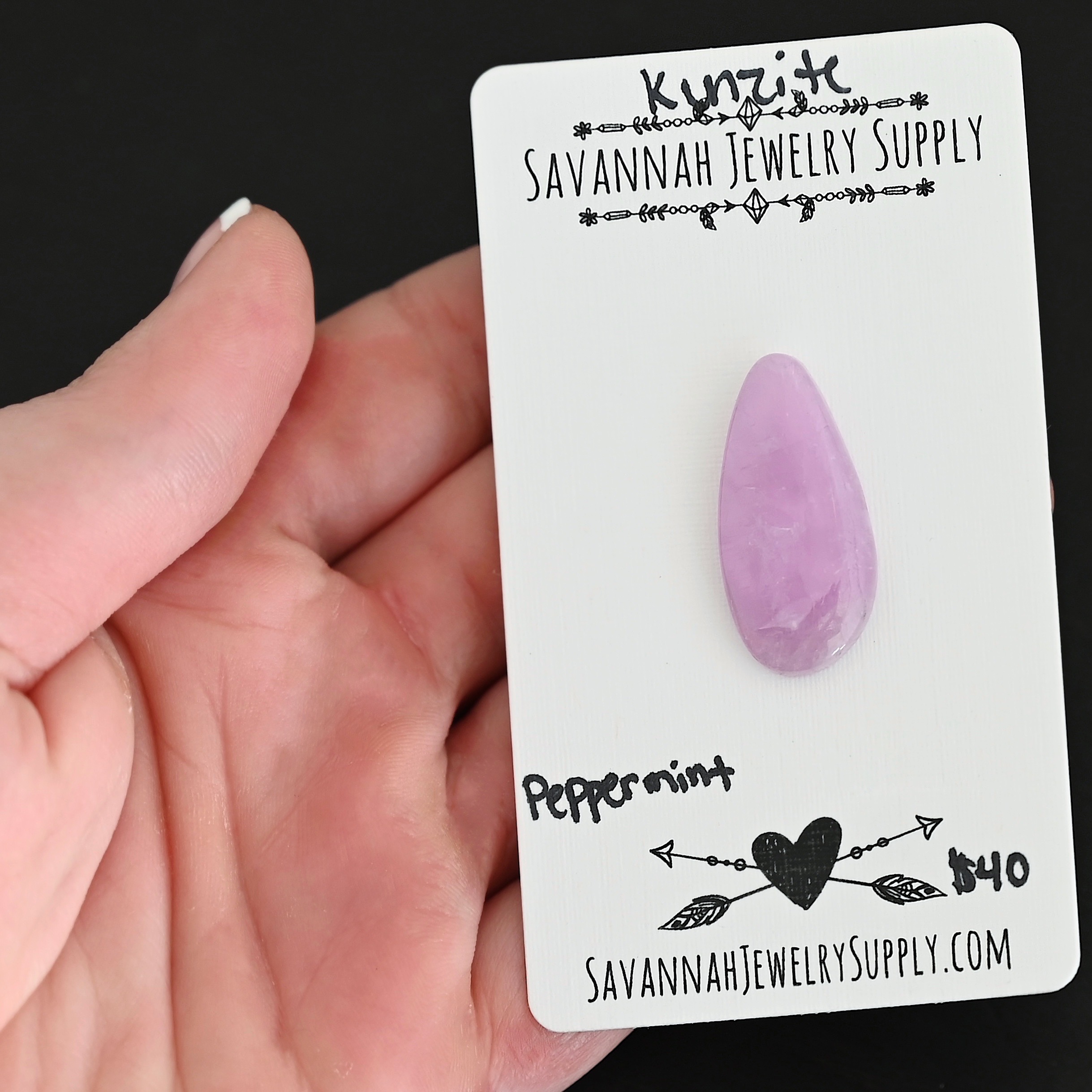 Peppermint Kunzite Cabochon Parcel shown in hand