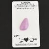 Piper Kunzite Cabochon Parcel shown on business card