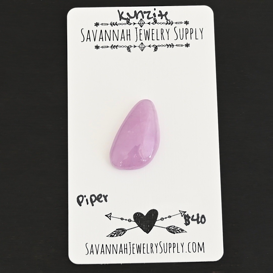 Piper Kunzite Cabochon Parcel shown on business card