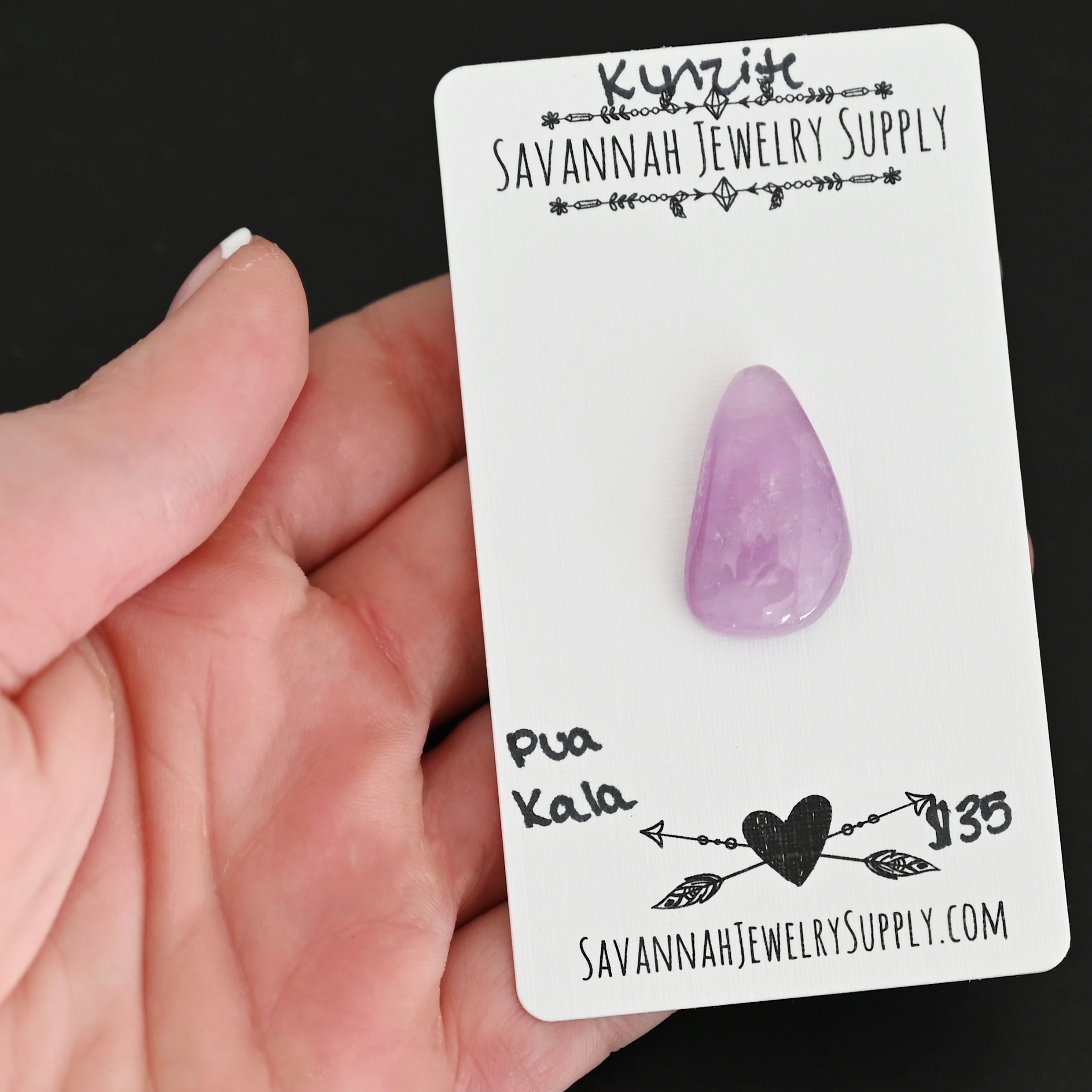 Pua Kala Kunzite Cabochon Parcel shown in hand