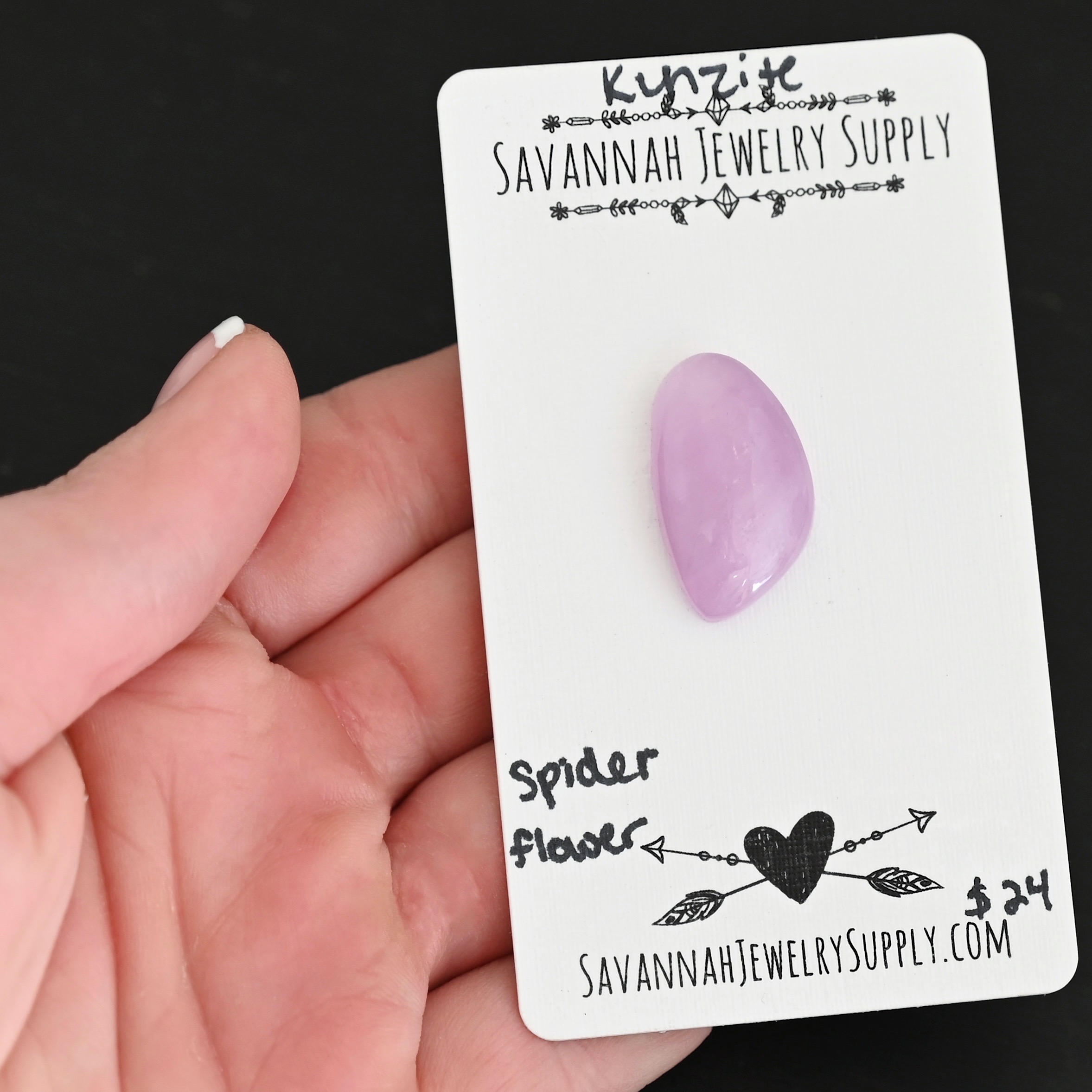 Spider Flower Kunzite Cabochon Parcel shown in hand