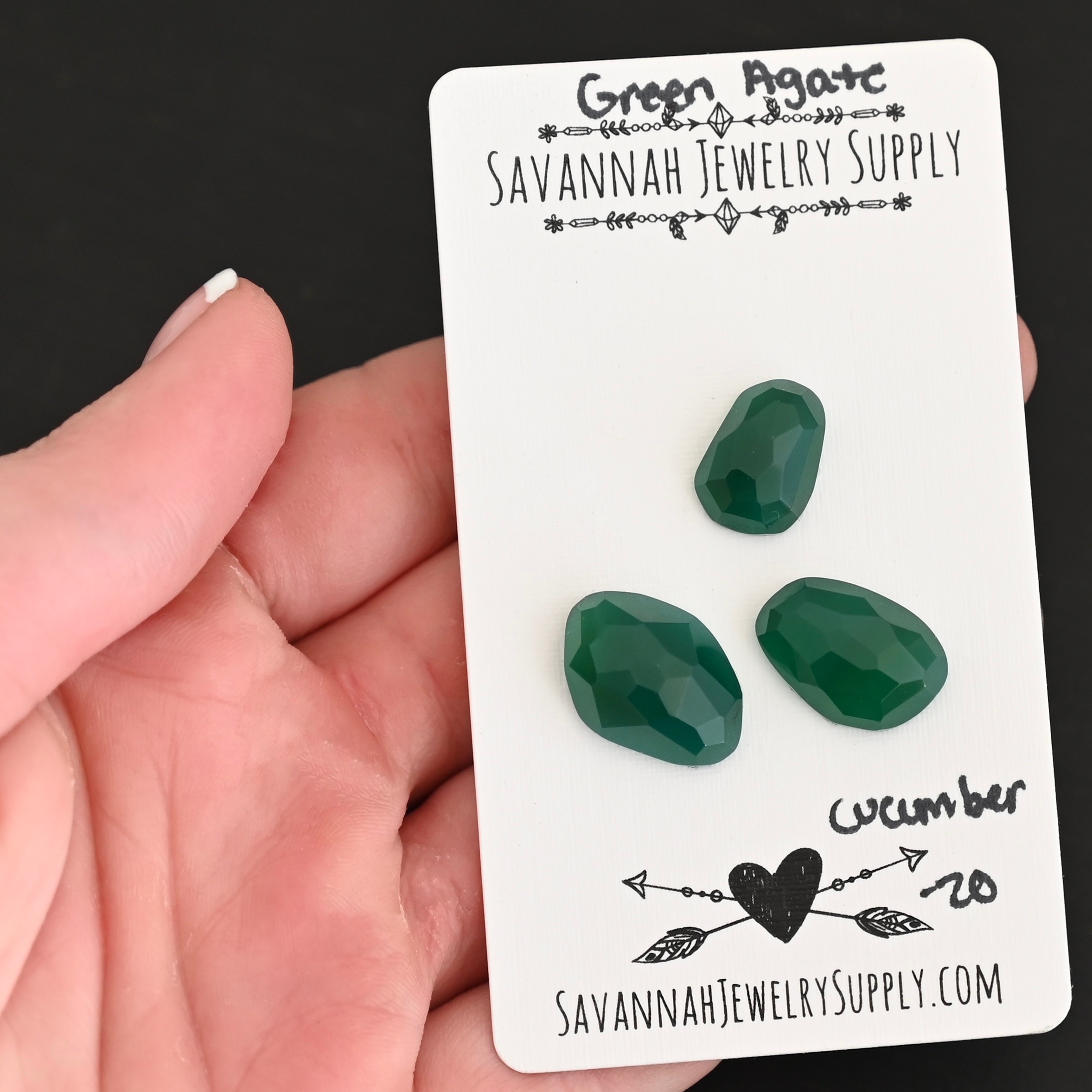 Cucumber Rose Cut Green Agate Cabochon Parcel shown in hand