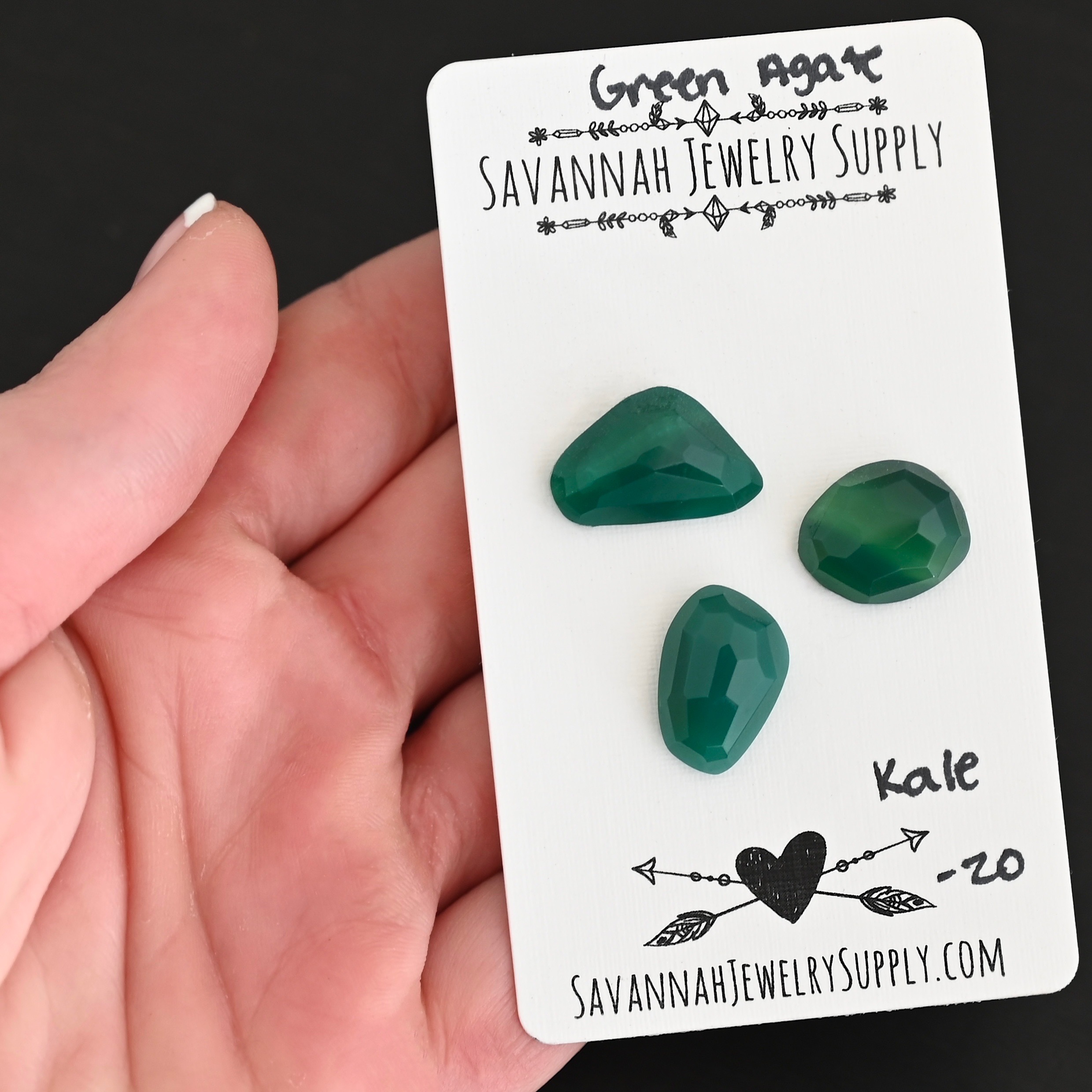 Kale Rose Cut Green Agate Cabochon Parcel shown in hand