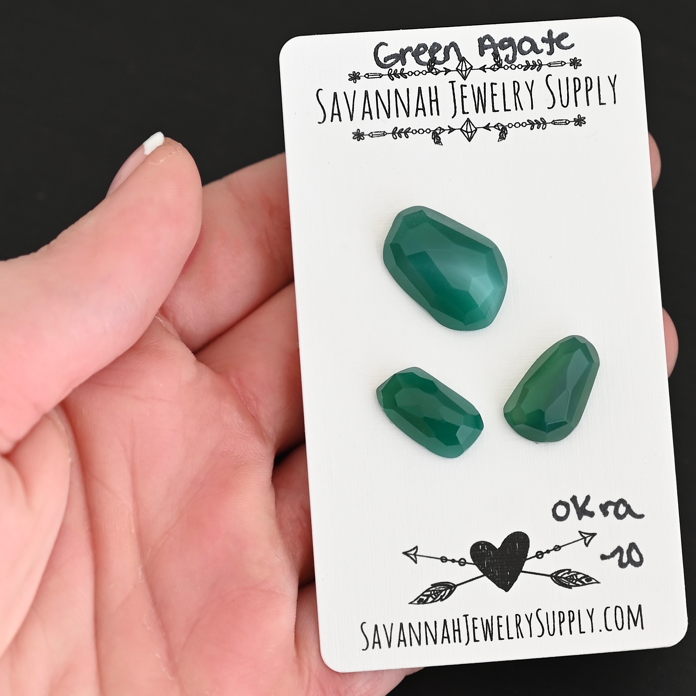 Okra Rose Cut Green Agate Cabochon Parcel shown in hand