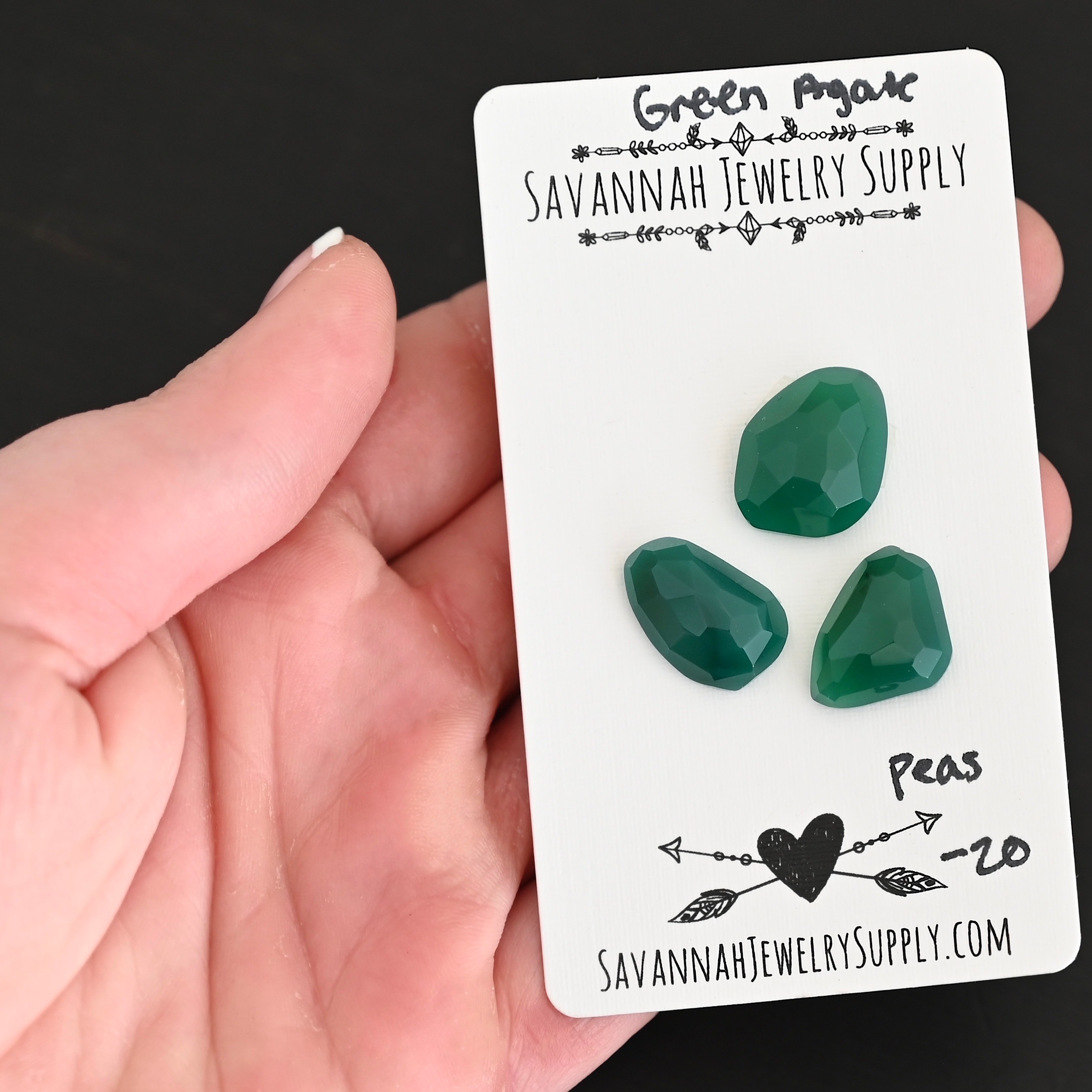 Peas Rose Cut Green Agate Cabochon Parcel shown in hand