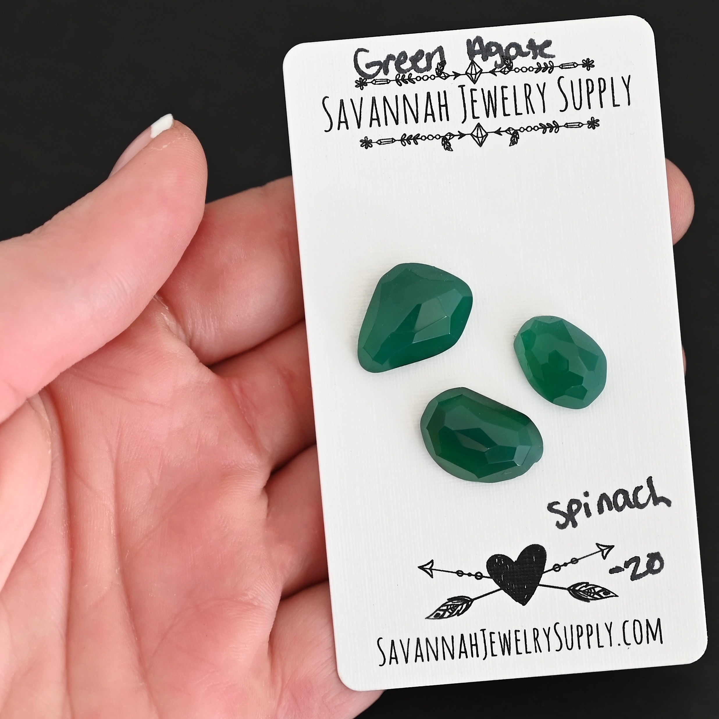 Spinach Rose Cut Green Agate Cabochon Parcel shown in hand