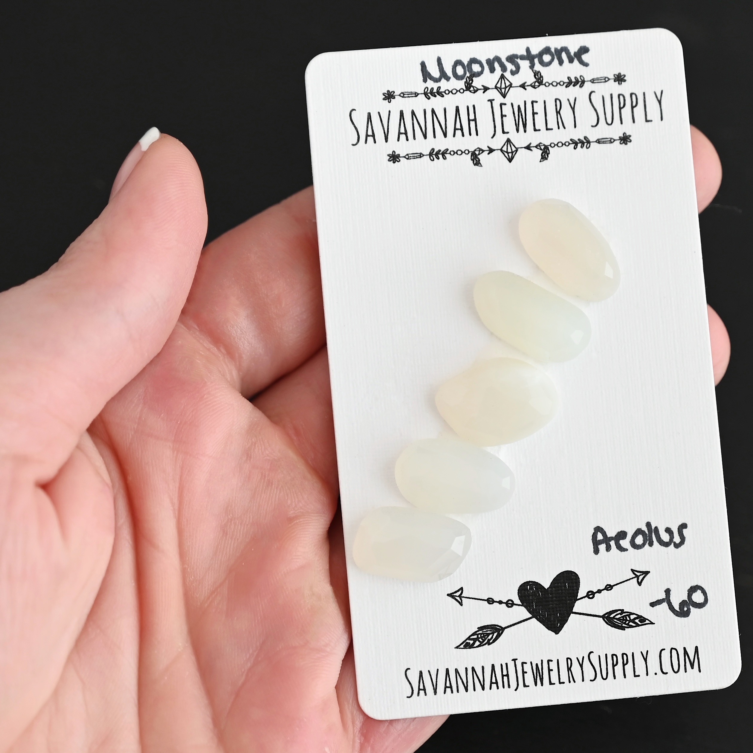 Aelous Rose Cut Moonstone Cabochon Parcel shown in hand