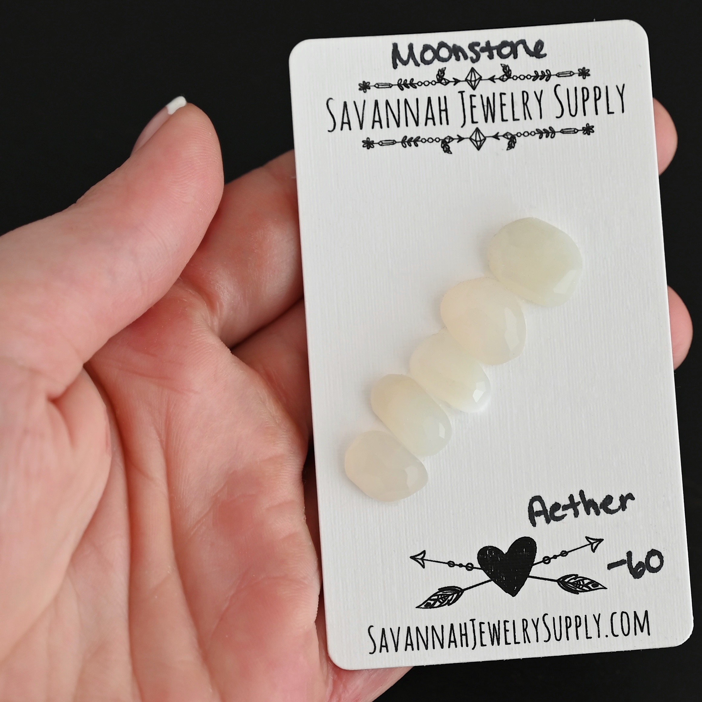 Aether Rose Cut Moonstone Cabochon Parcel shown in hand