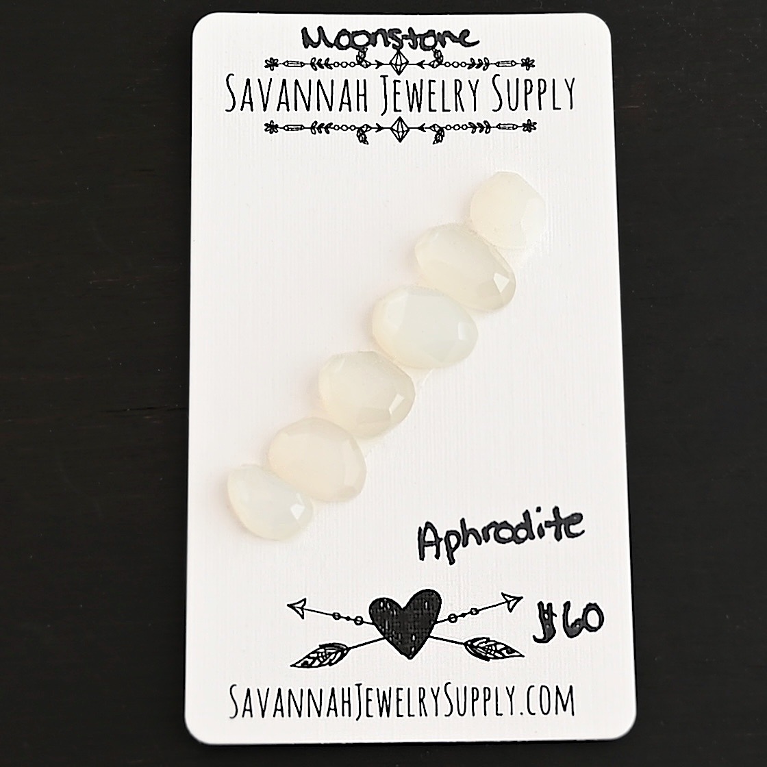 Aphrodite Rose Cut Moonstone Cabochon Parcel shown on business card