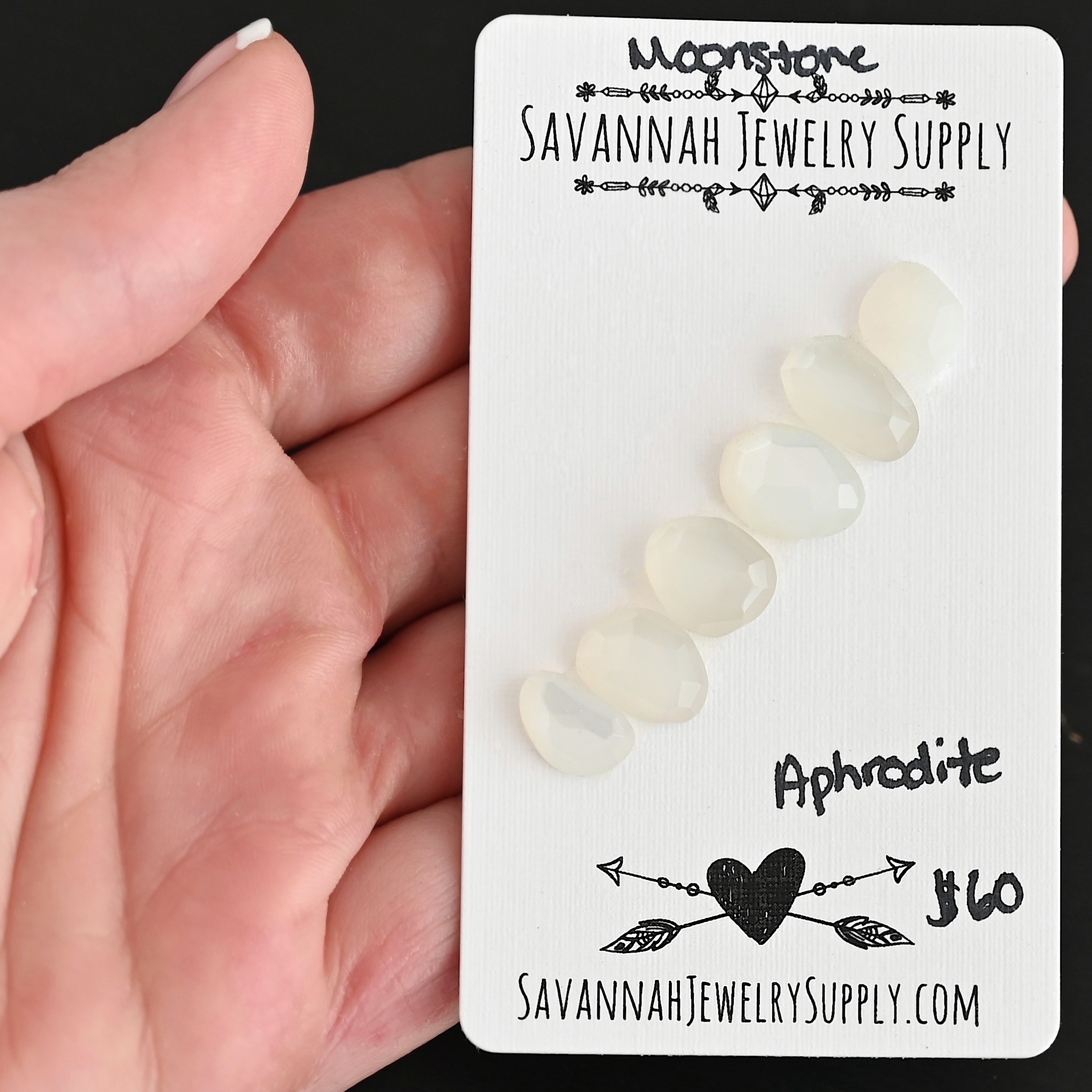 Aphrodite Rose Cut Moonstone Cabochon Parcel shown in hand
