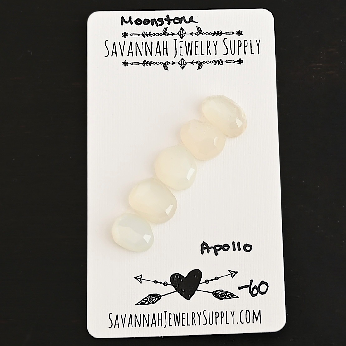 Apollo Rose Cut Moonstone Cabochon Parcel shown on business card