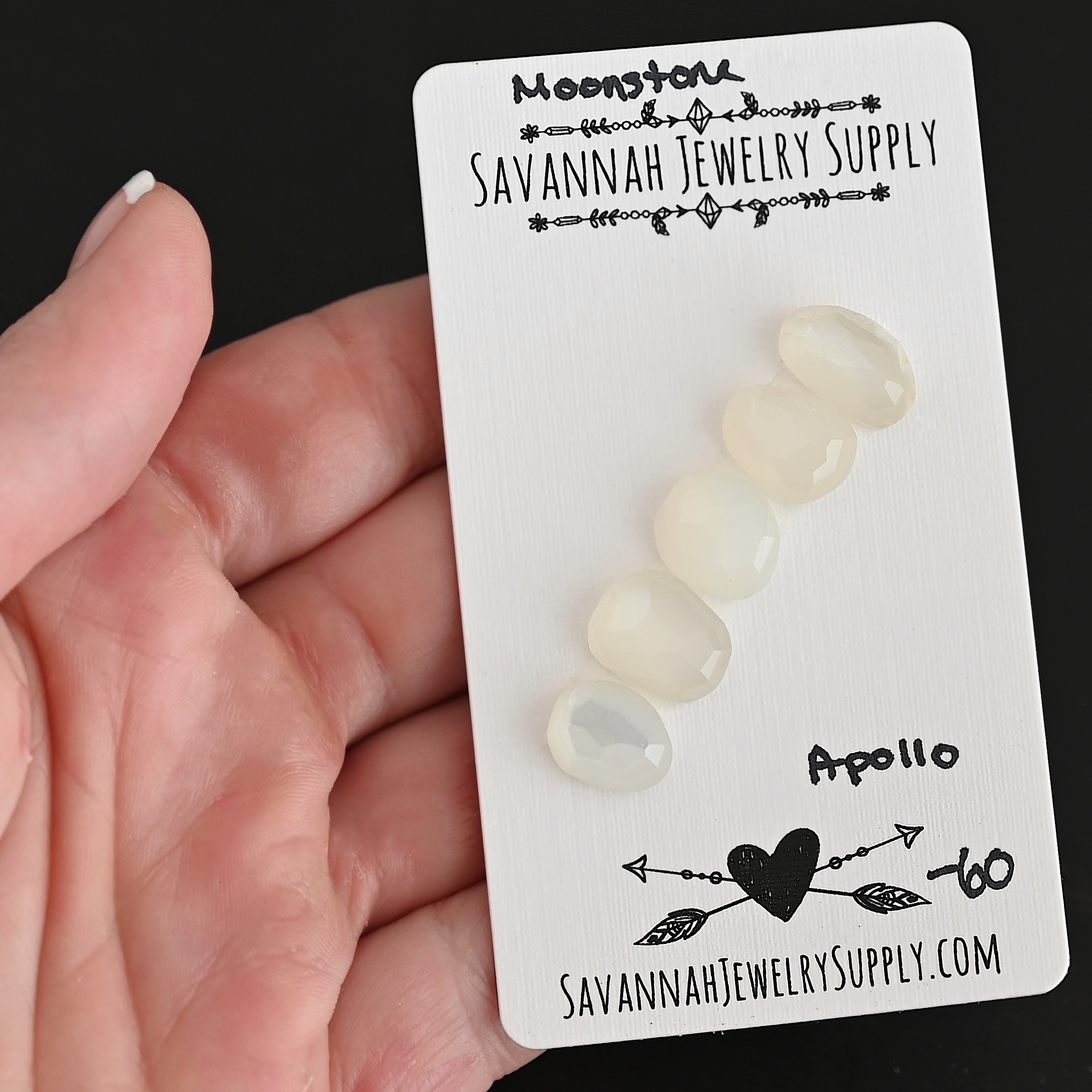 Apollo Rose Cut Moonstone Cabochon Parcel shown in hand