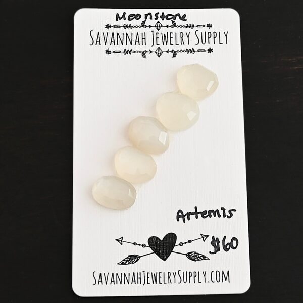 Artemis Rose Cut Moonstone Cabochon Parcel shown on business card