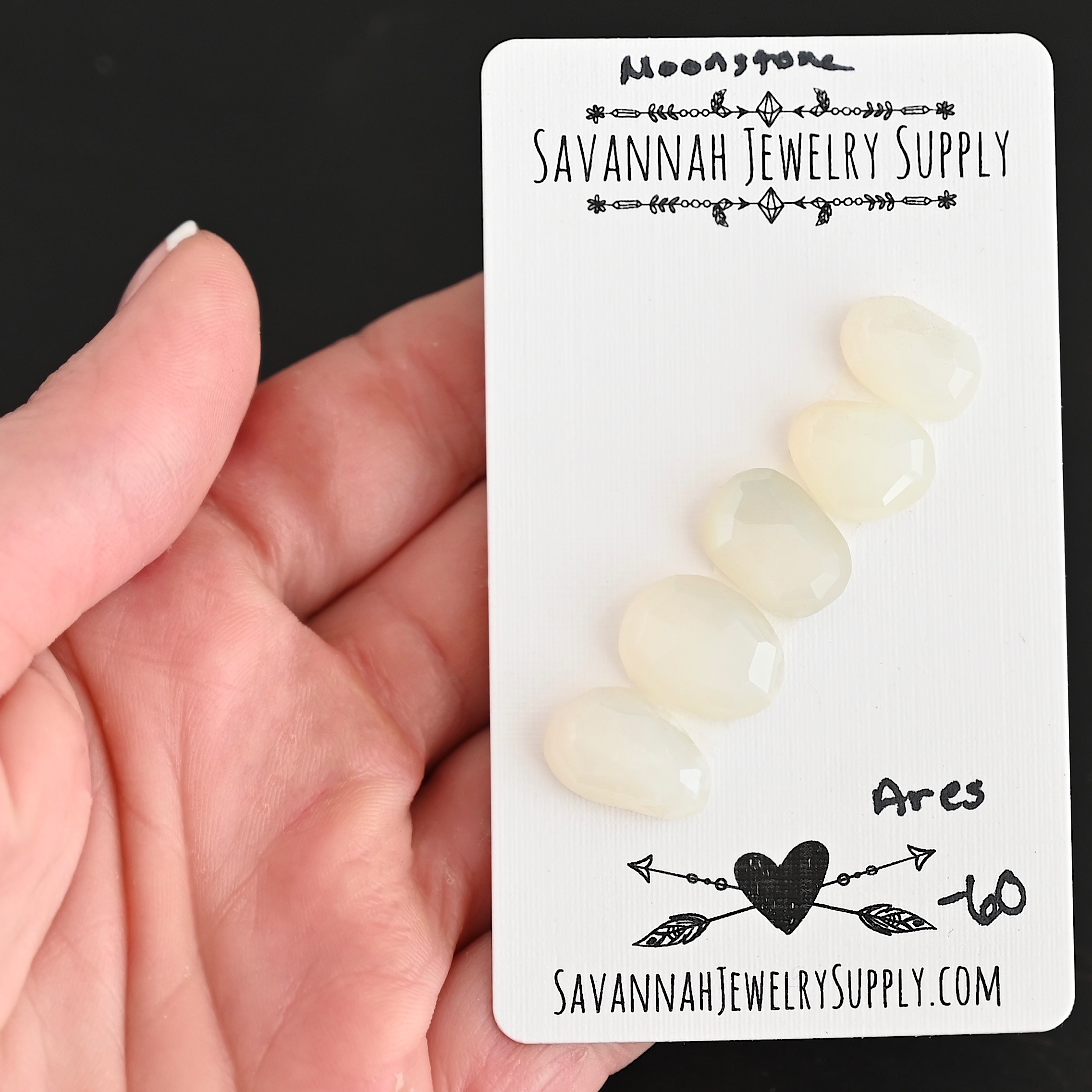 Ares Rose Cut Moonstone Cabochon Parcel shown in hand