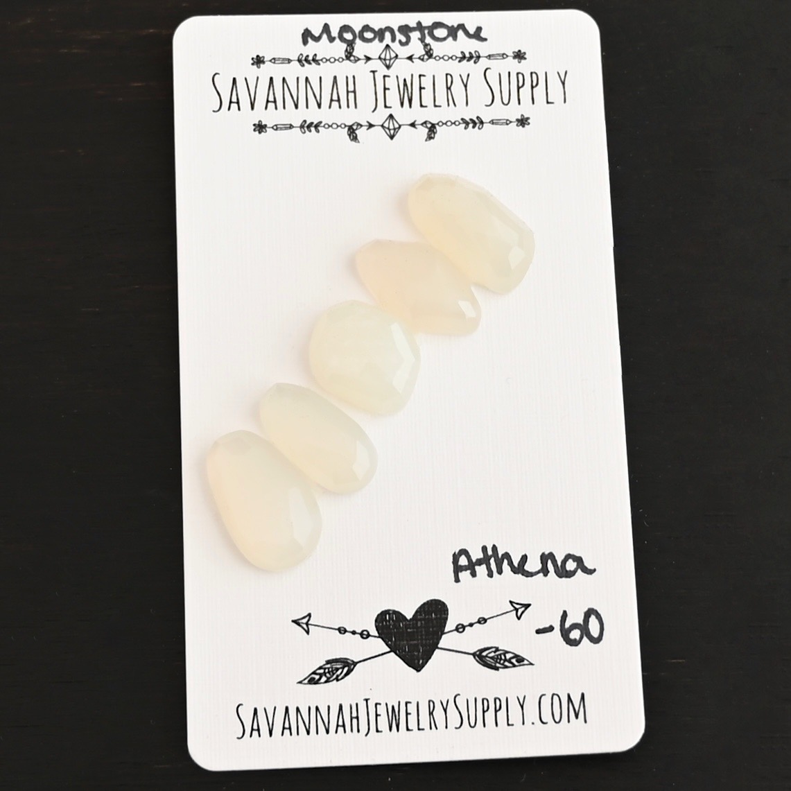 Athena Rose Cut Moonstone Cabochon Parcel shown on business card