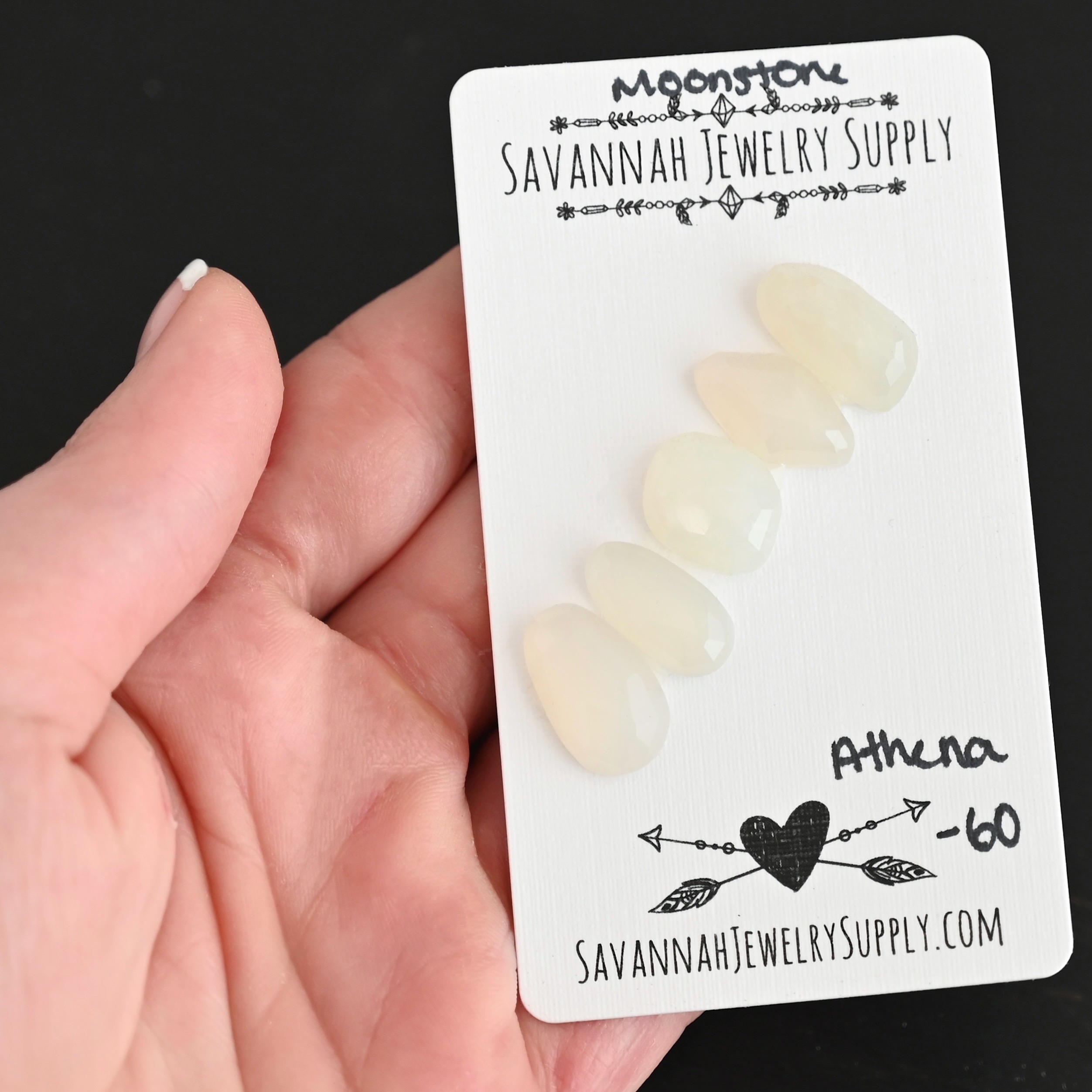 Athena Rose Cut Moonstone Cabochon Parcel shown in hand