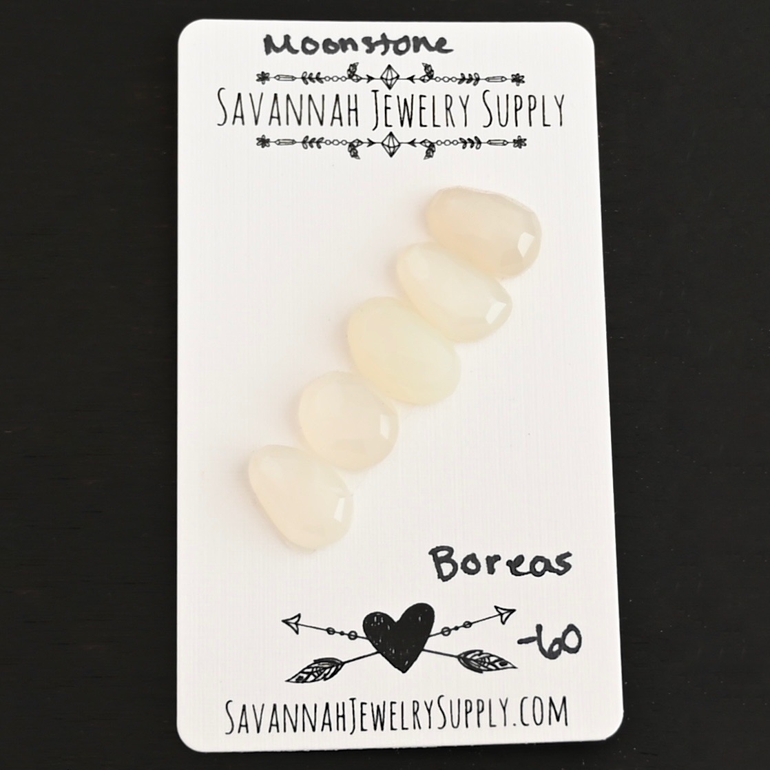Boreas Rose Cut Moonstone Cabochon Parcel shown on business card