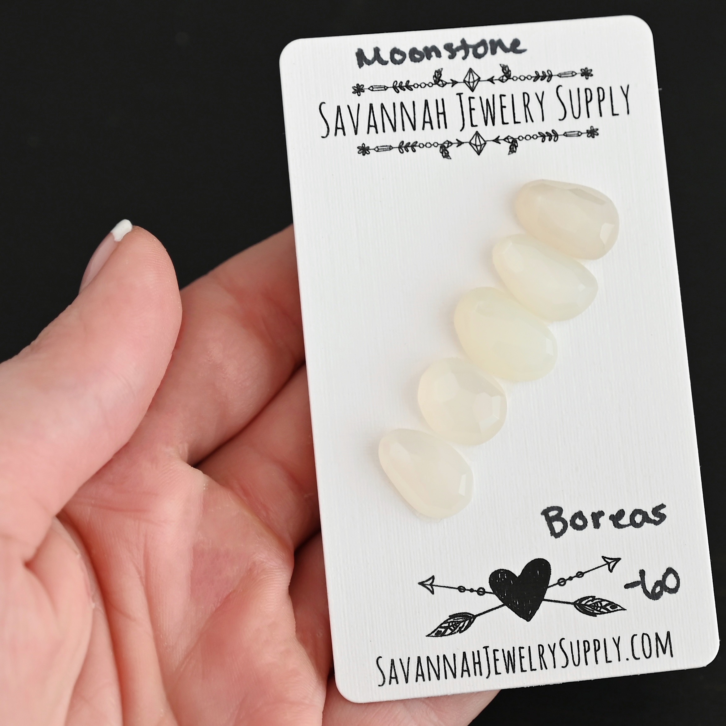 Boreas Rose Cut Moonstone Cabochon Parcel shown in hand