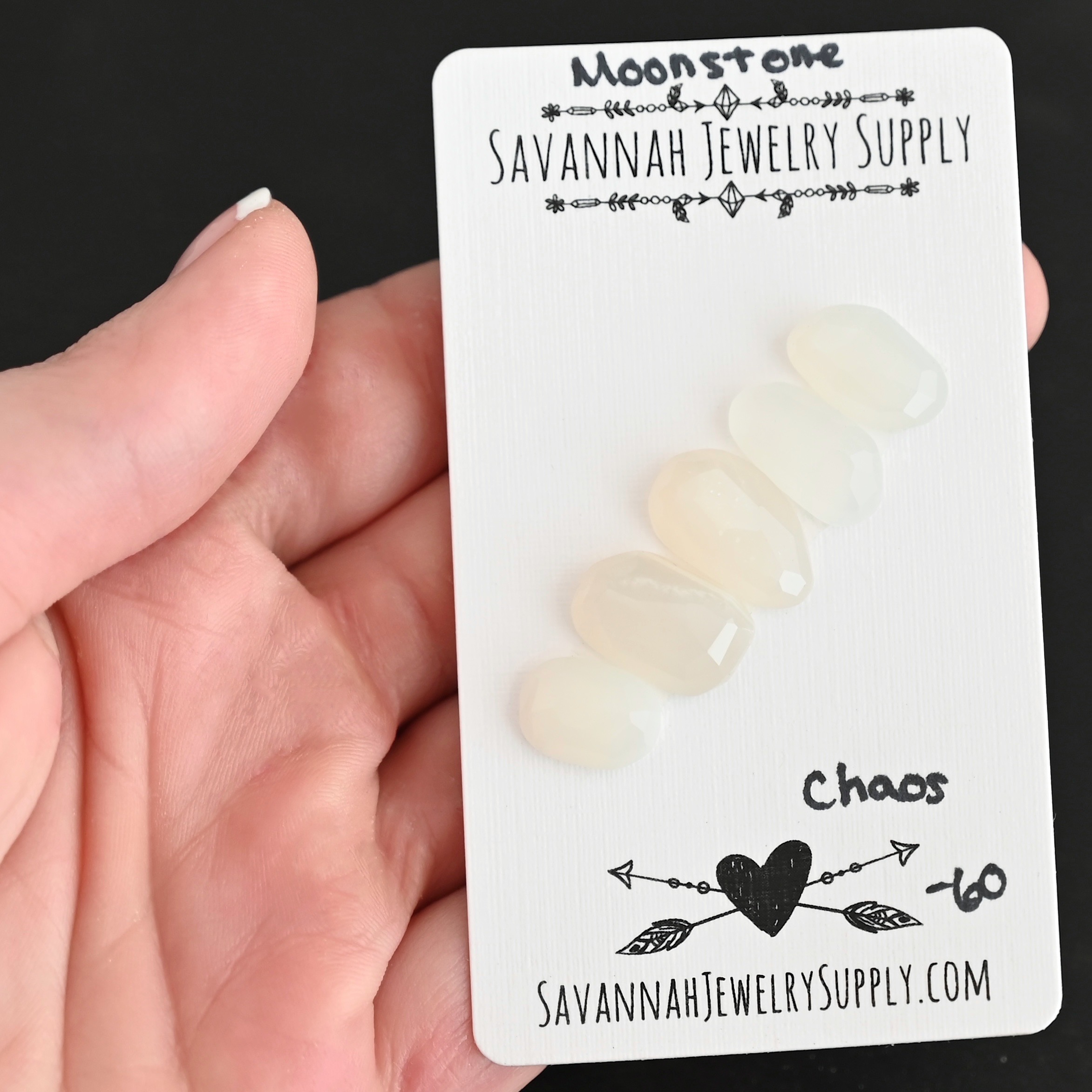 Chaos Rose Cut Moonstone Cabochon Parcel shown in hand