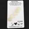 Chronos Rose Cut Moonstone Cabochon Parcel shown on business card