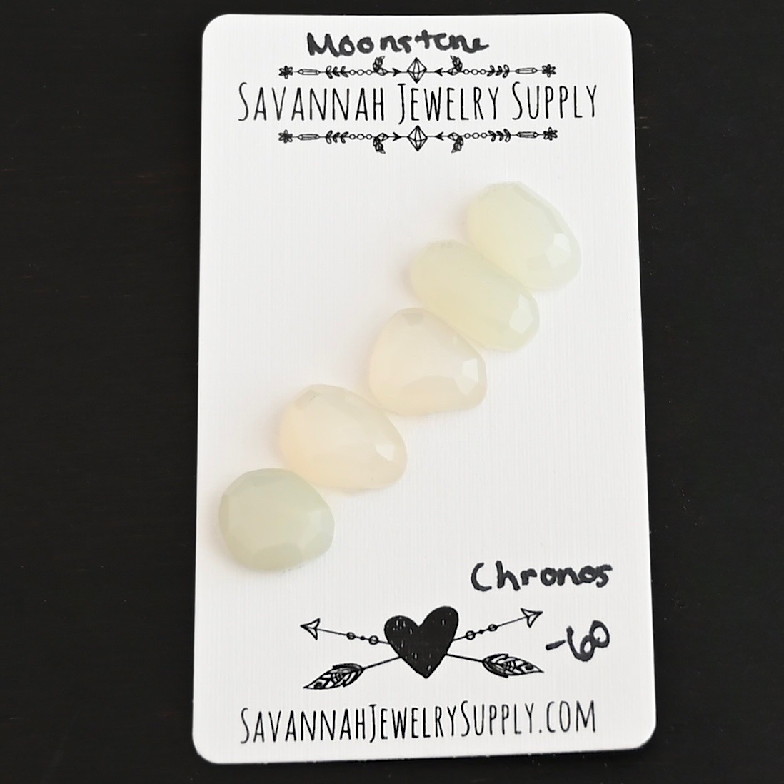 Chronos Rose Cut Moonstone Cabochon Parcel shown on business card
