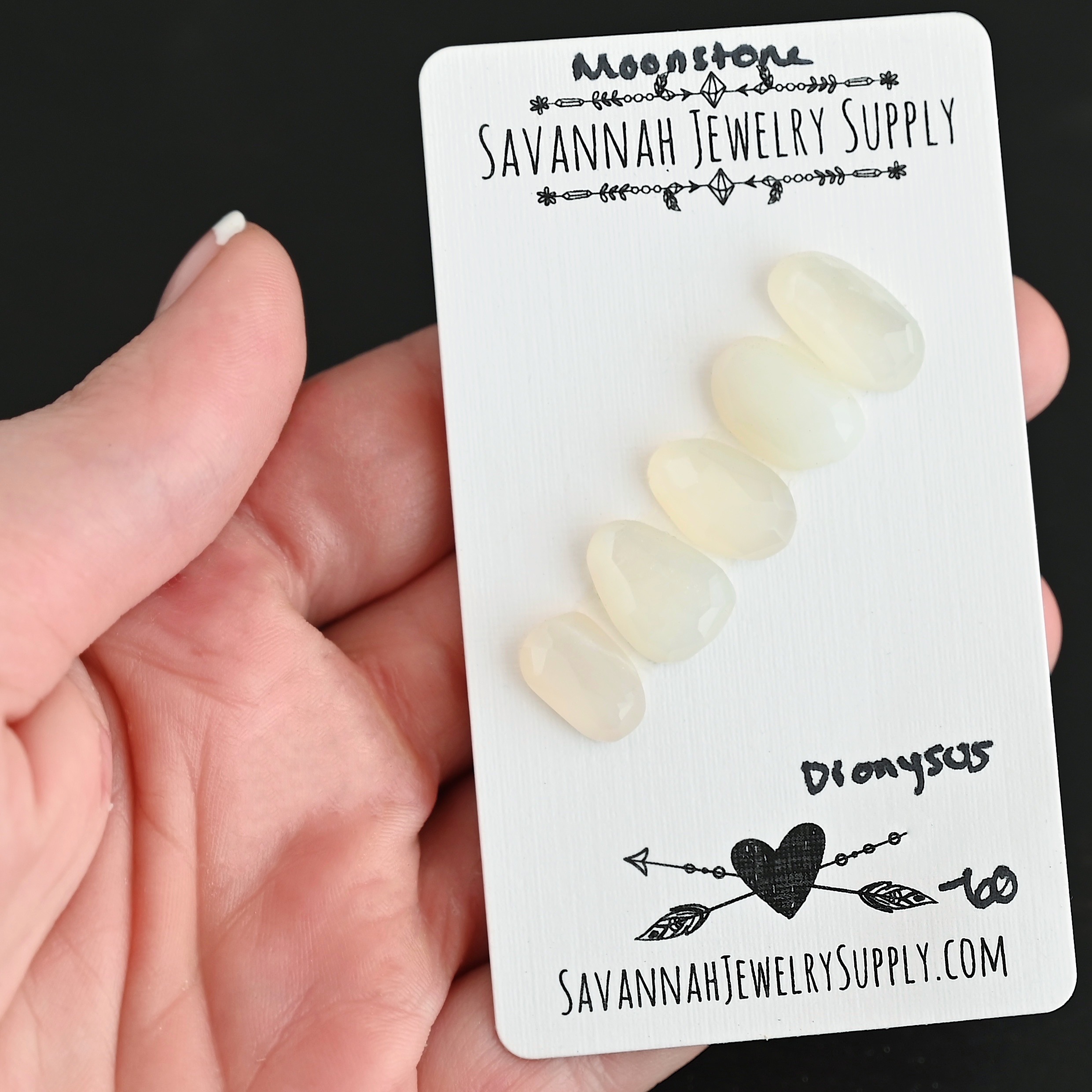 Dionysus Rose Cut Moonstone Cabochon Parcel shown in hand