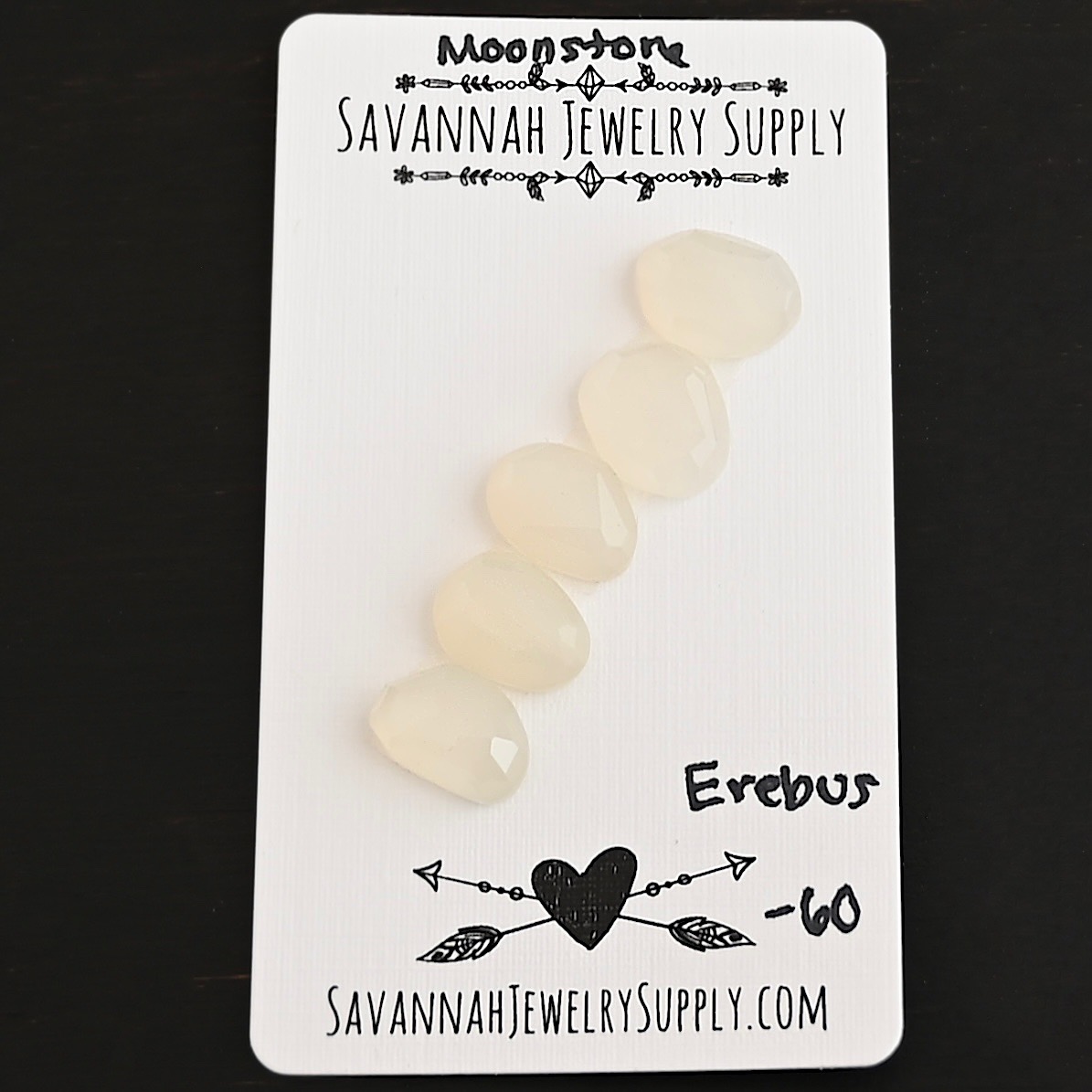 Erebus Rose Cut Moonstone Cabochon Parcel shown on business card