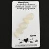 Eros Rose Cut Moonstone Cabochon Parcel shown on business card