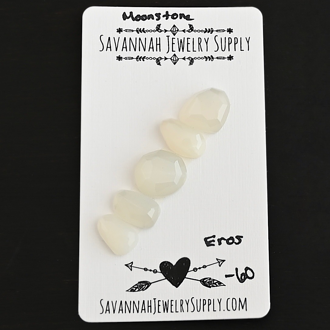 Eros Rose Cut Moonstone Cabochon Parcel shown on business card