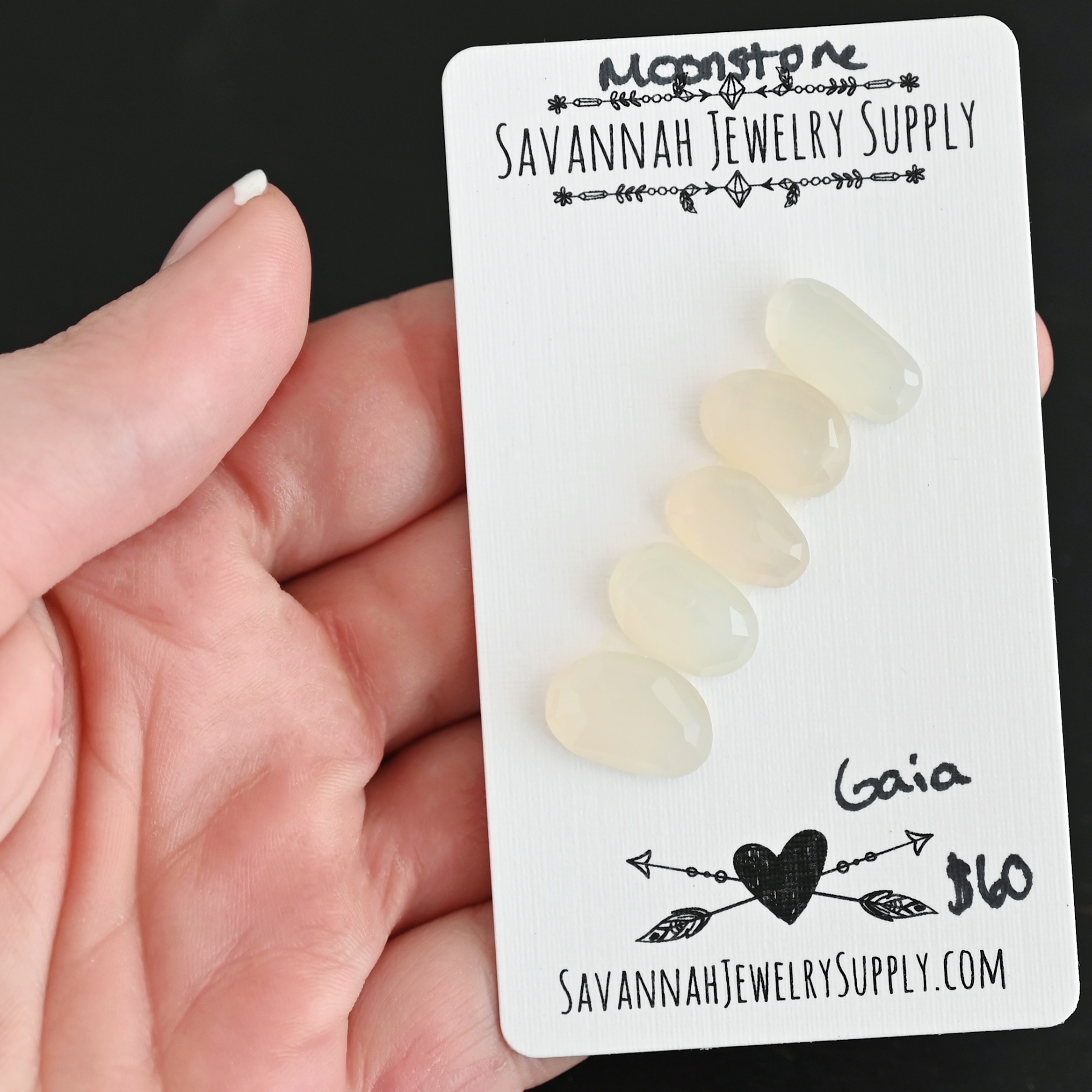 Gaia Rose Cut Moonstone Cabochon Parcel shown in hand