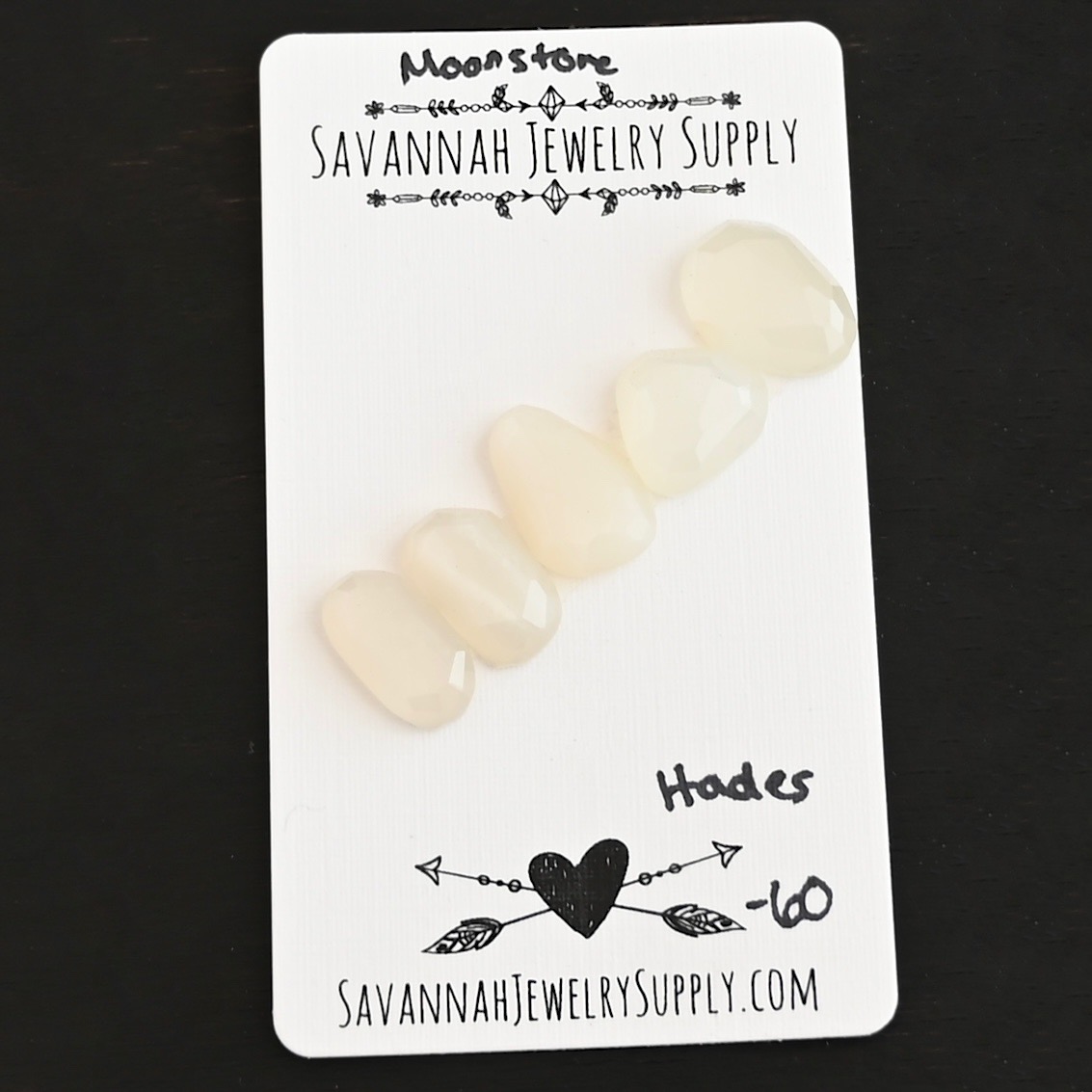Hades Rose Cut Moonstone Cabochon Parcel shown on business card