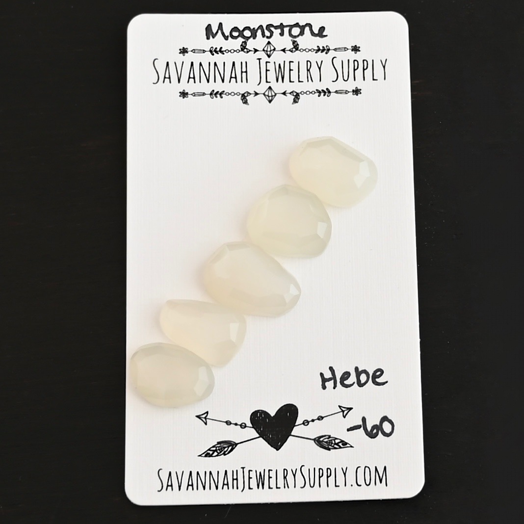 Hebe Rose Cut Moonstone Cabochon Parcel shown on business card