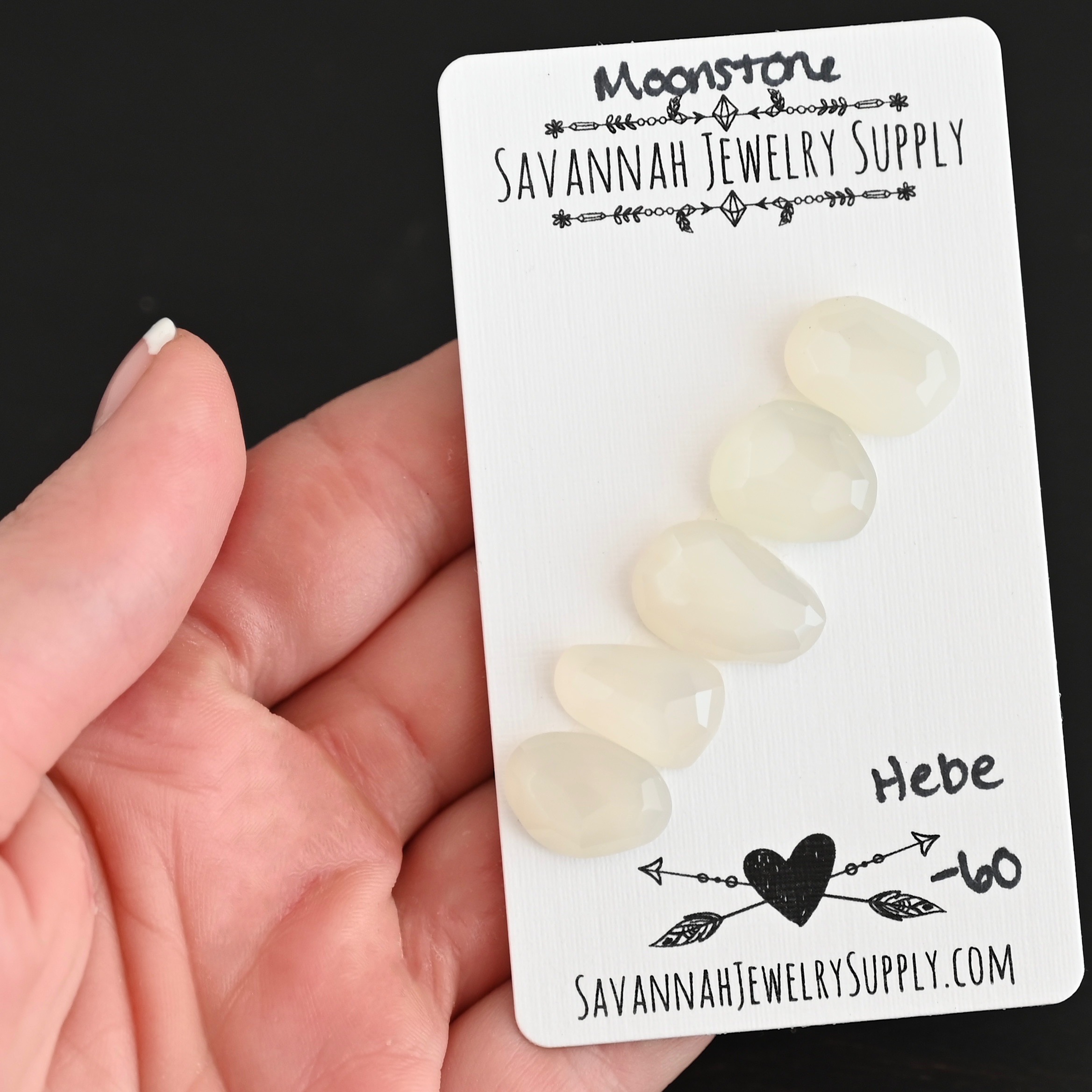 Hebe Rose Cut Moonstone Cabochon Parcel shown in hand