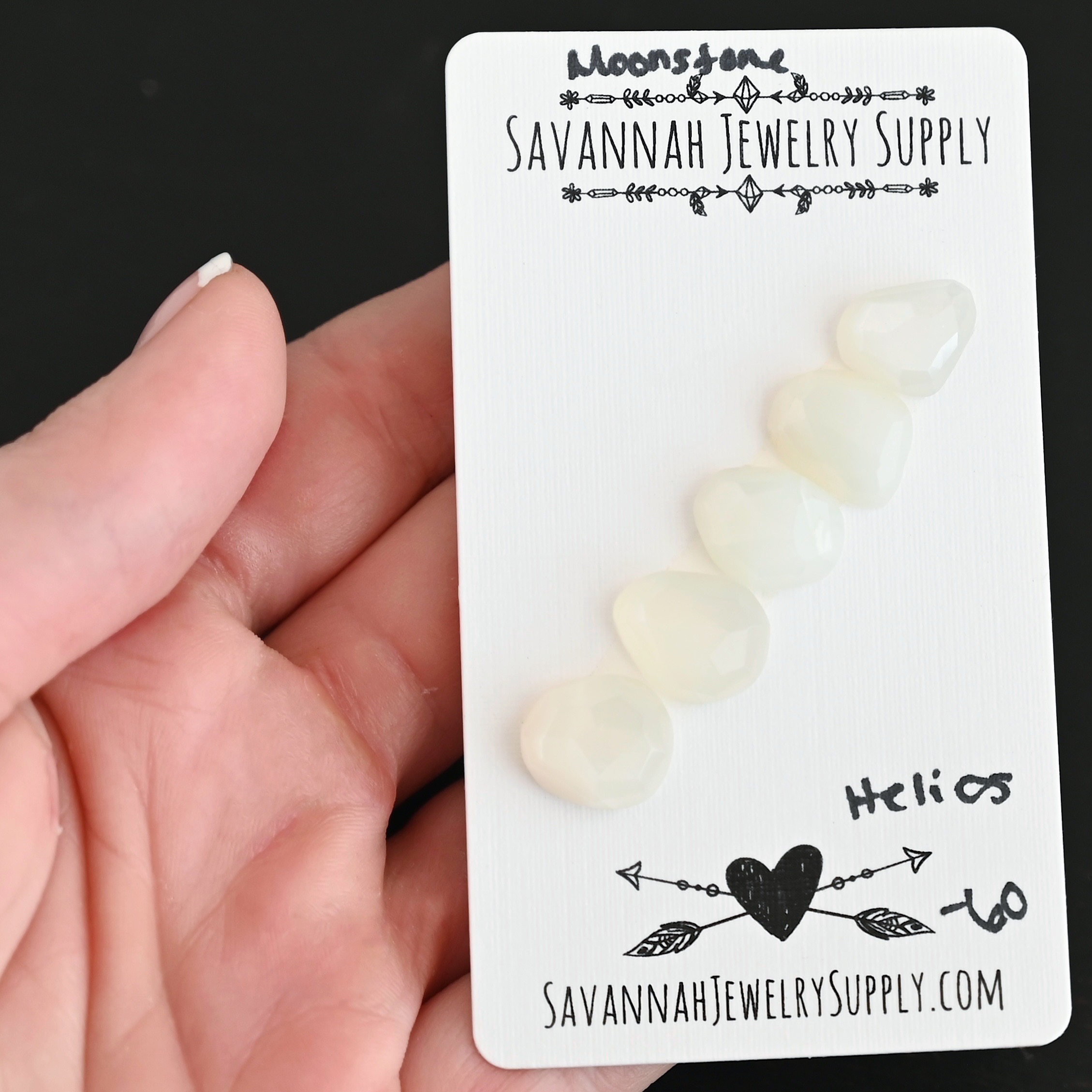 Helios Rose Cut Moonstone Cabochon Parcel shown in hand