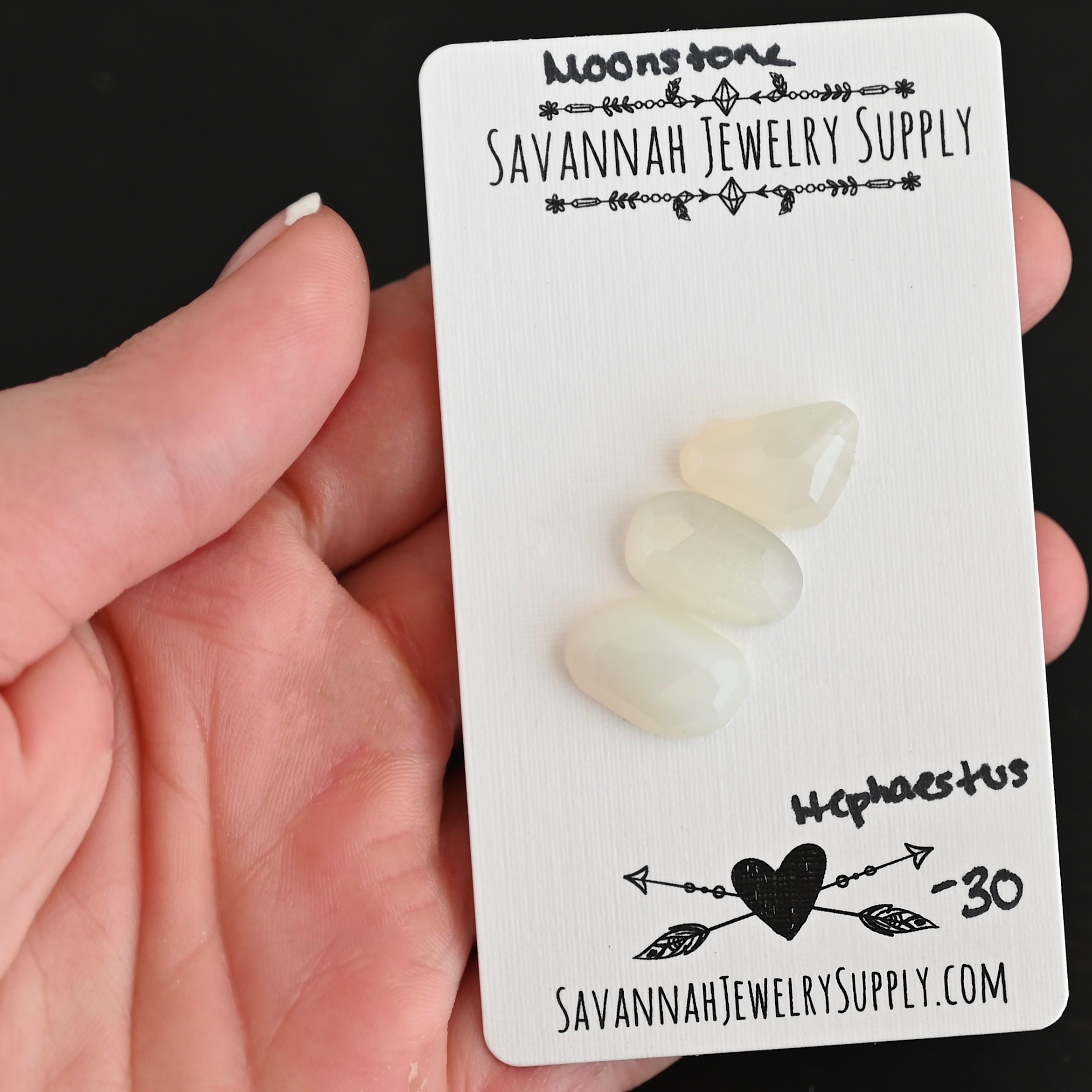 Hephaestus Rose Cut Moonstone Cabochon Parcel shown in hand