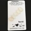 Heracles Rose Cut Moonstone Cabochon Parcel shown on business card