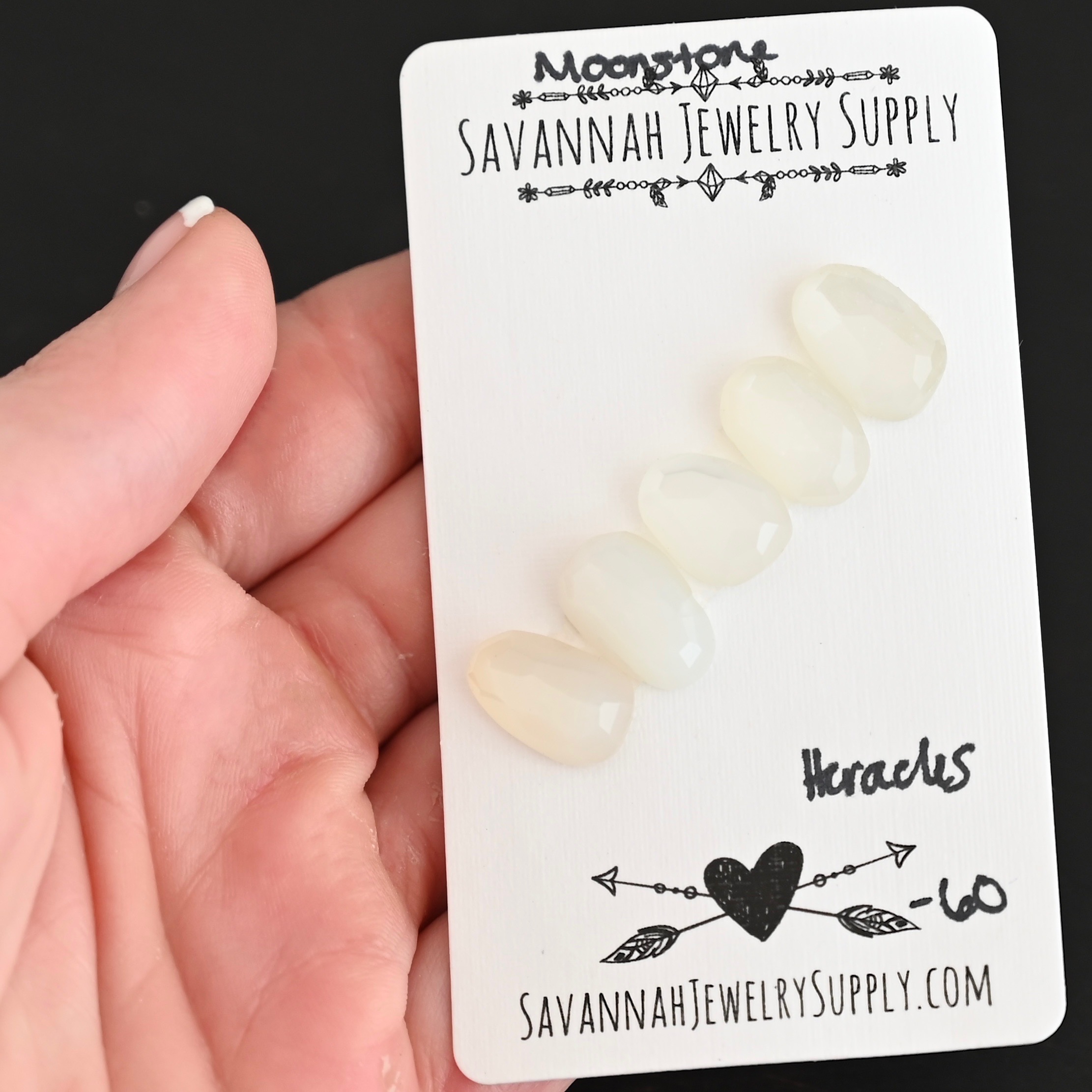 Heracles Rose Cut Moonstone Cabochon Parcel shown in hand