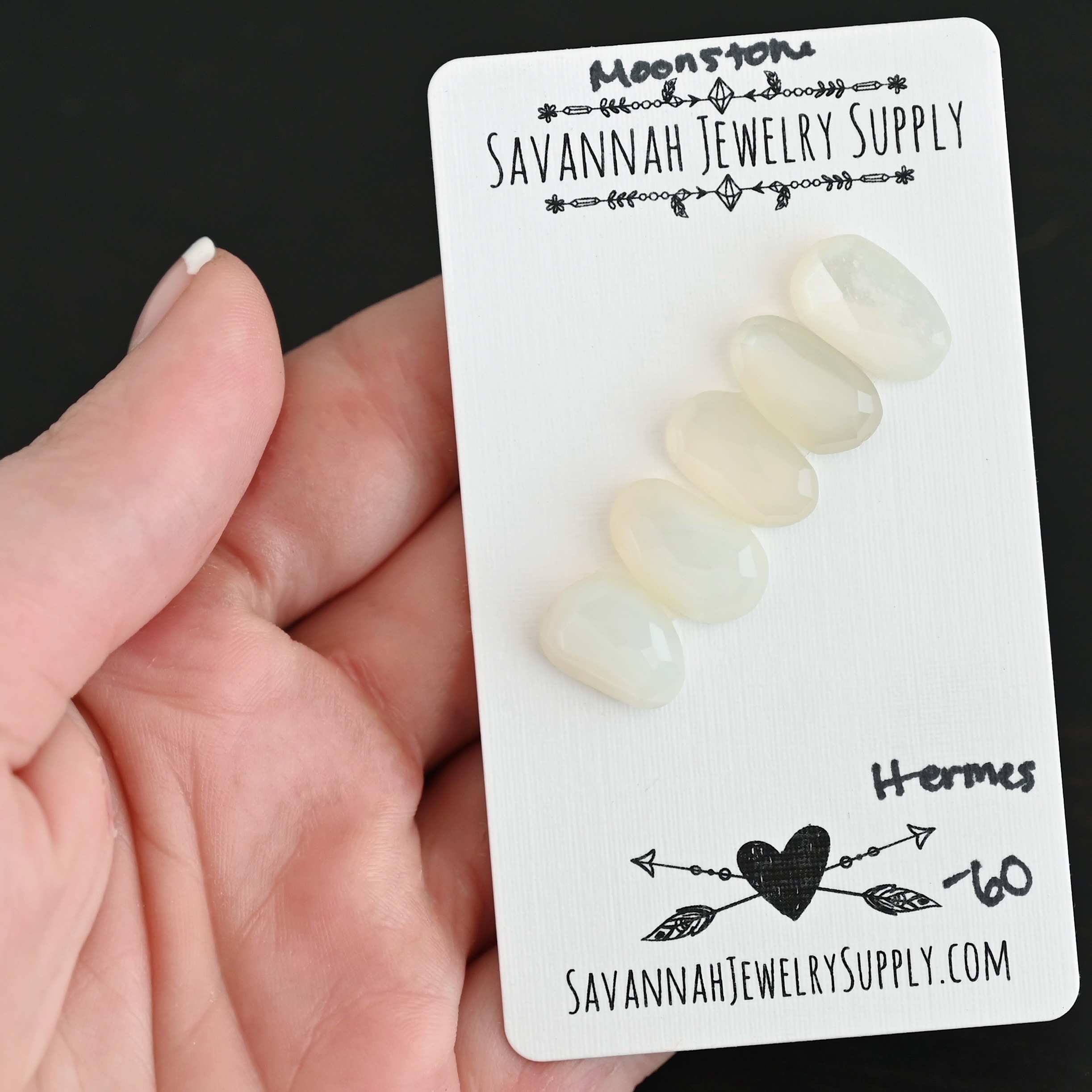 Hermes Rose Cut Moonstone Cabochon Parcel shown in hand