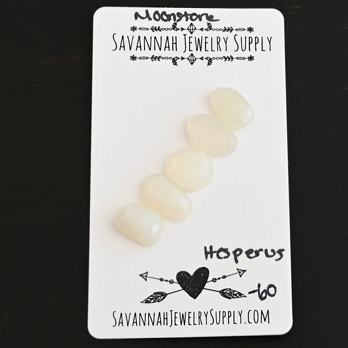 Hesperus Rose Cut Moonstone Cabochon Parcel shown on business card