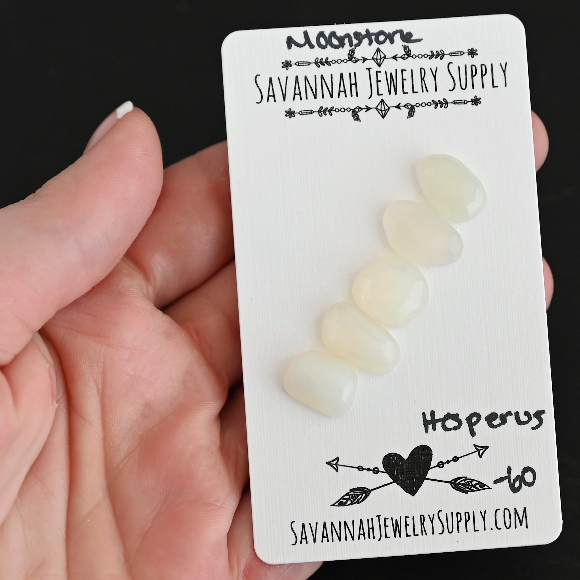 Hesperus Rose Cut Moonstone Cabochon Parcel shown in hand