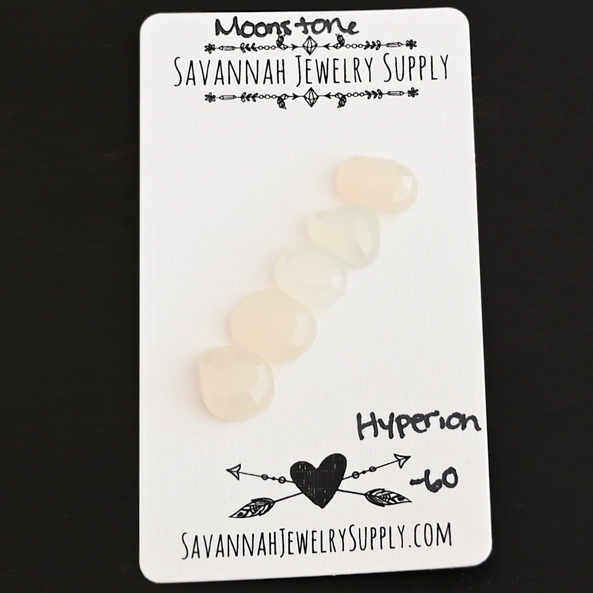 Hyperion Rose Cut Moonstone Cabochon Parcel shown on business card
