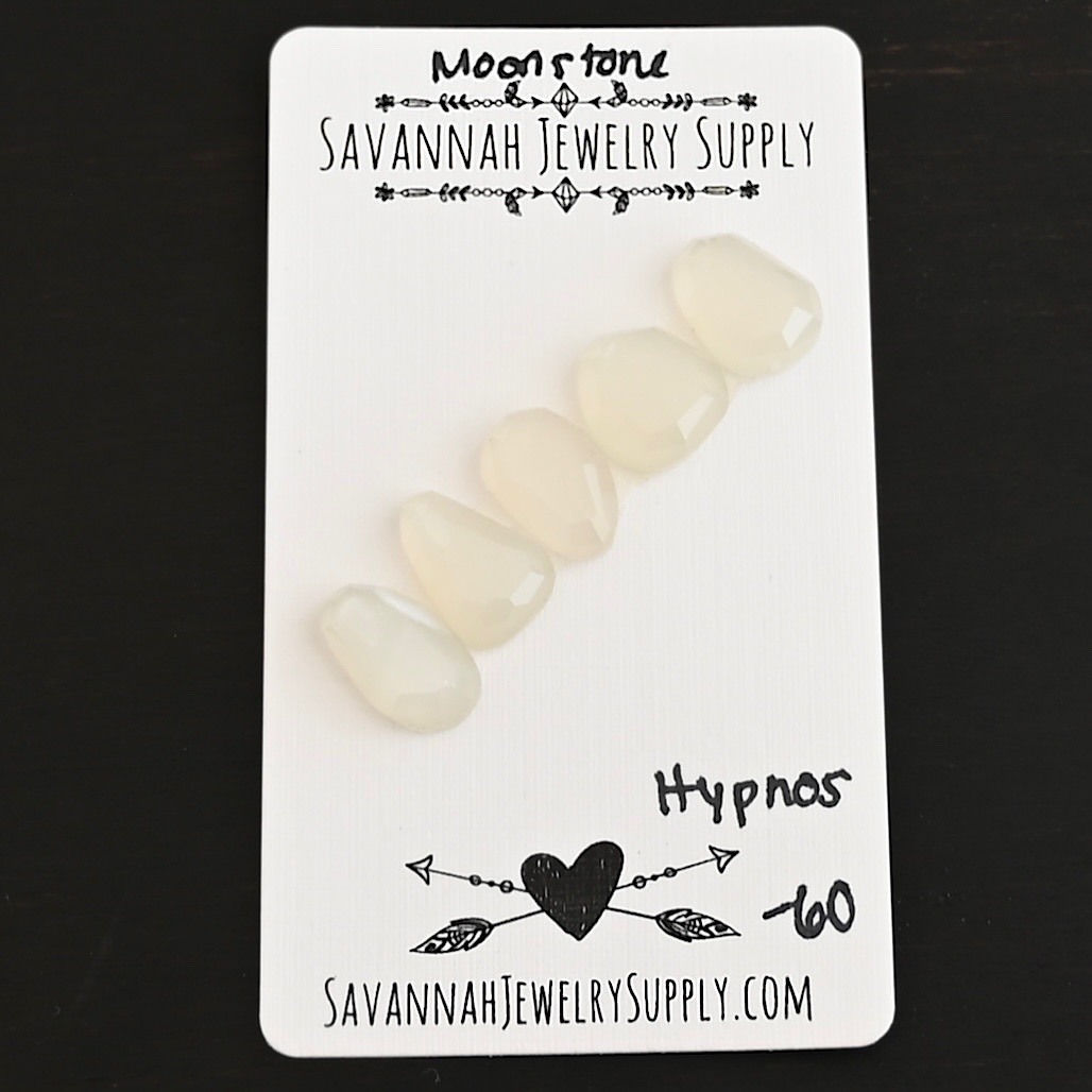 Hypnos Rose Cut Moonstone Cabochon Parcel shown on business card