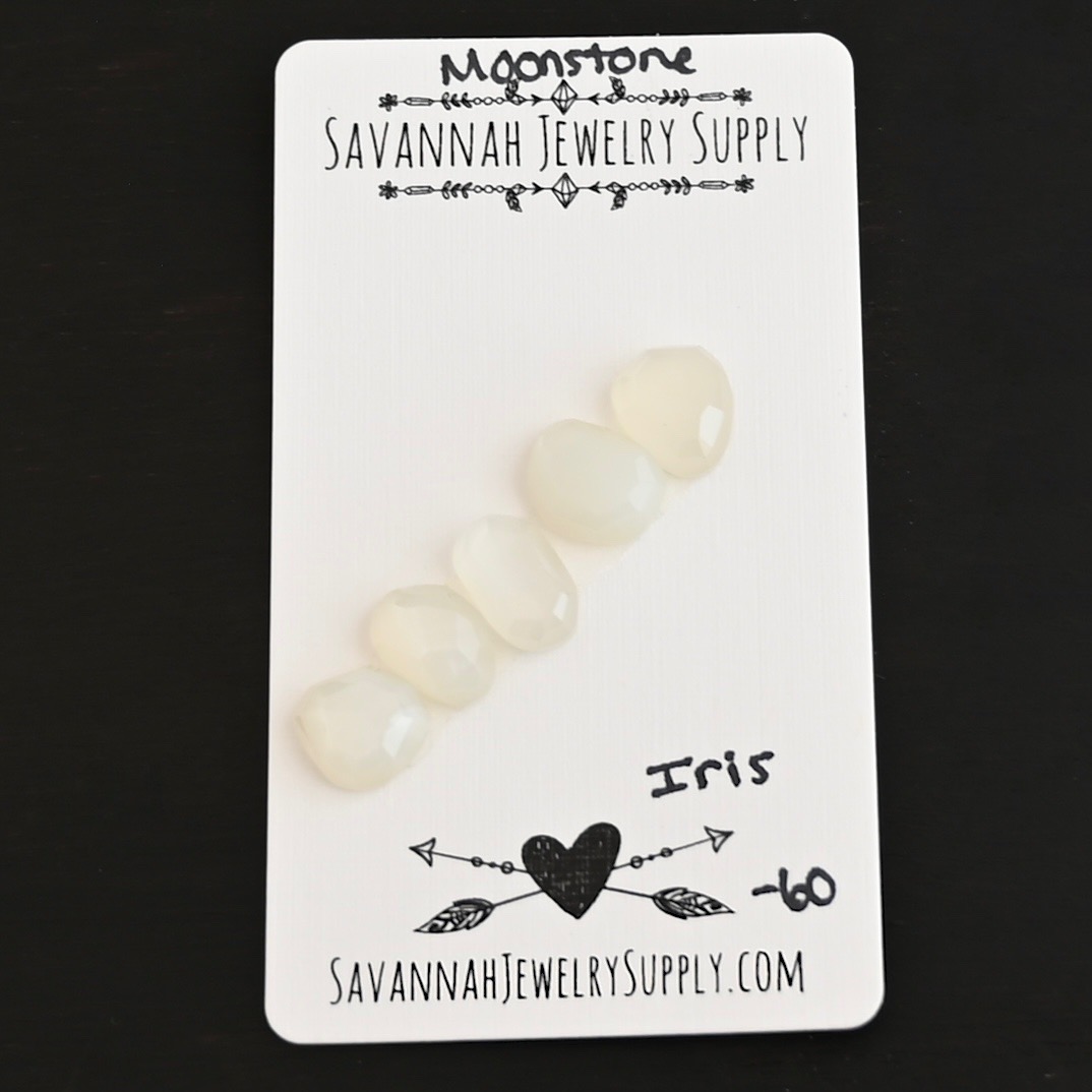 Iris Rose Cut Moonstone Cabochon Parcel shown on business card