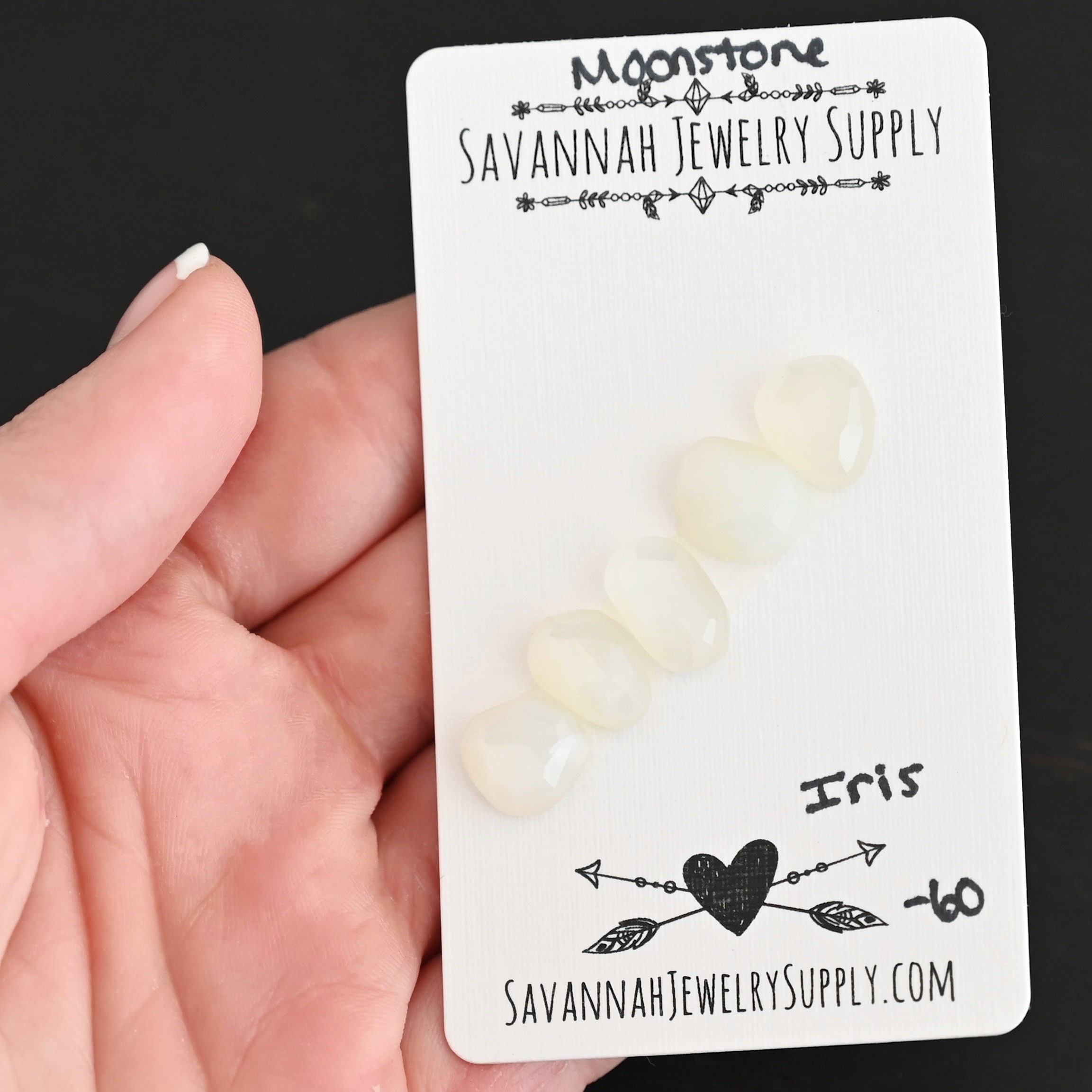 Iris Rose Cut Moonstone Cabochon Parcel shown in hand