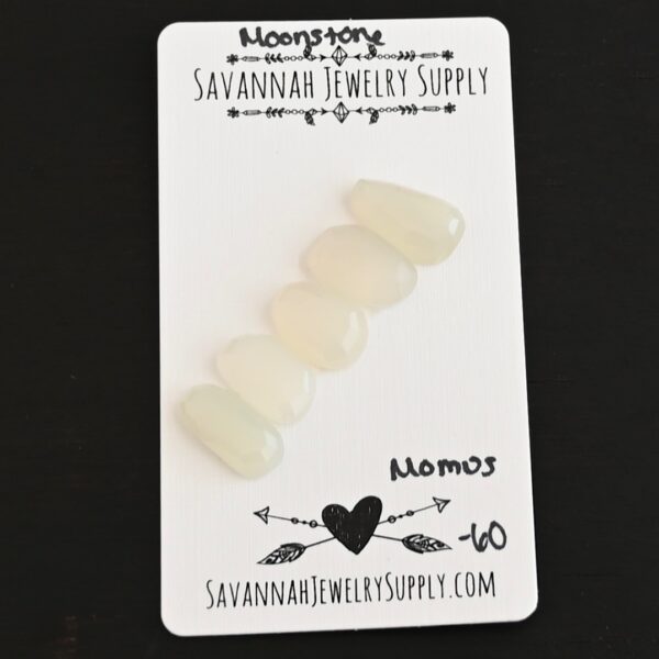 Momus Rose Cut Moonstone Cabochon Parcel shown on business card