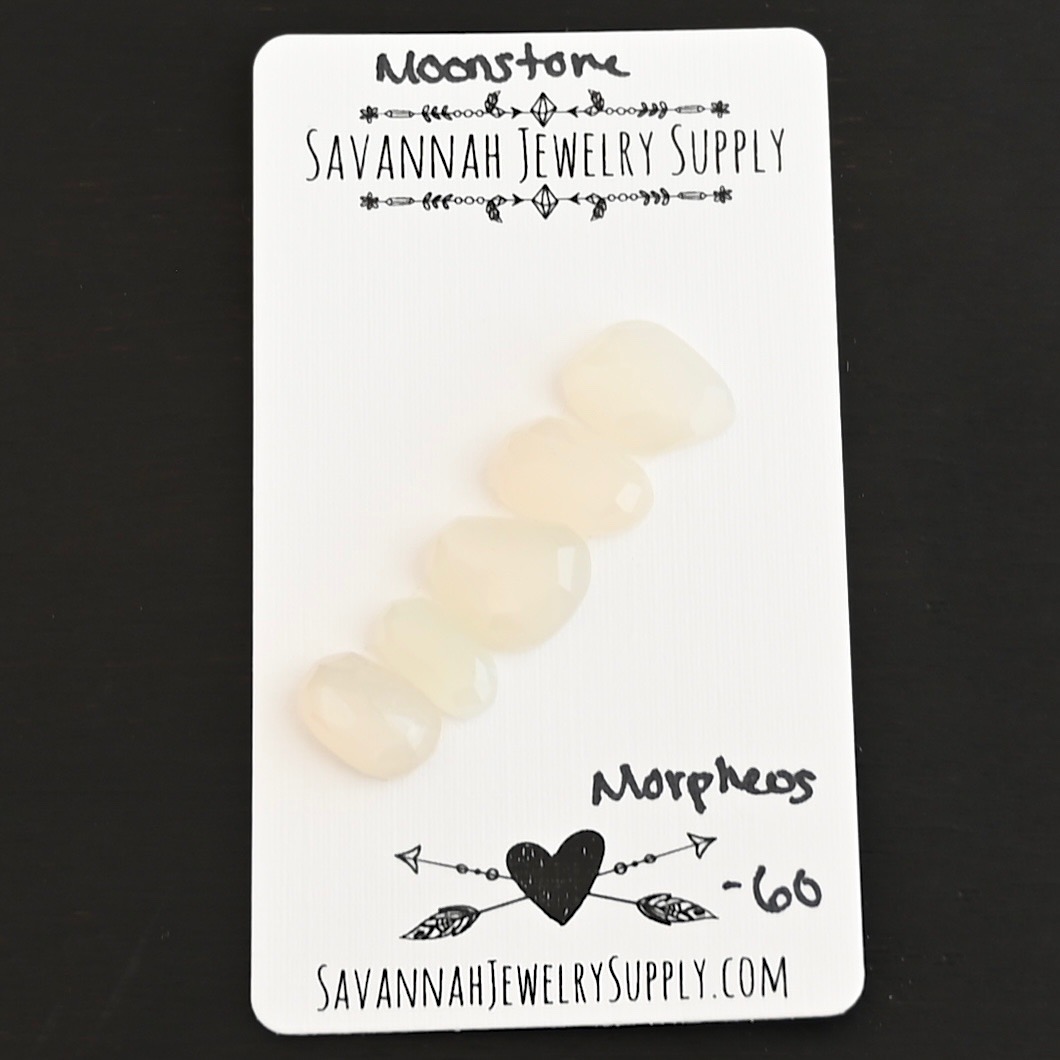 Morpheus Rose Cut Moonstone Cabochon Parcel shown on business card