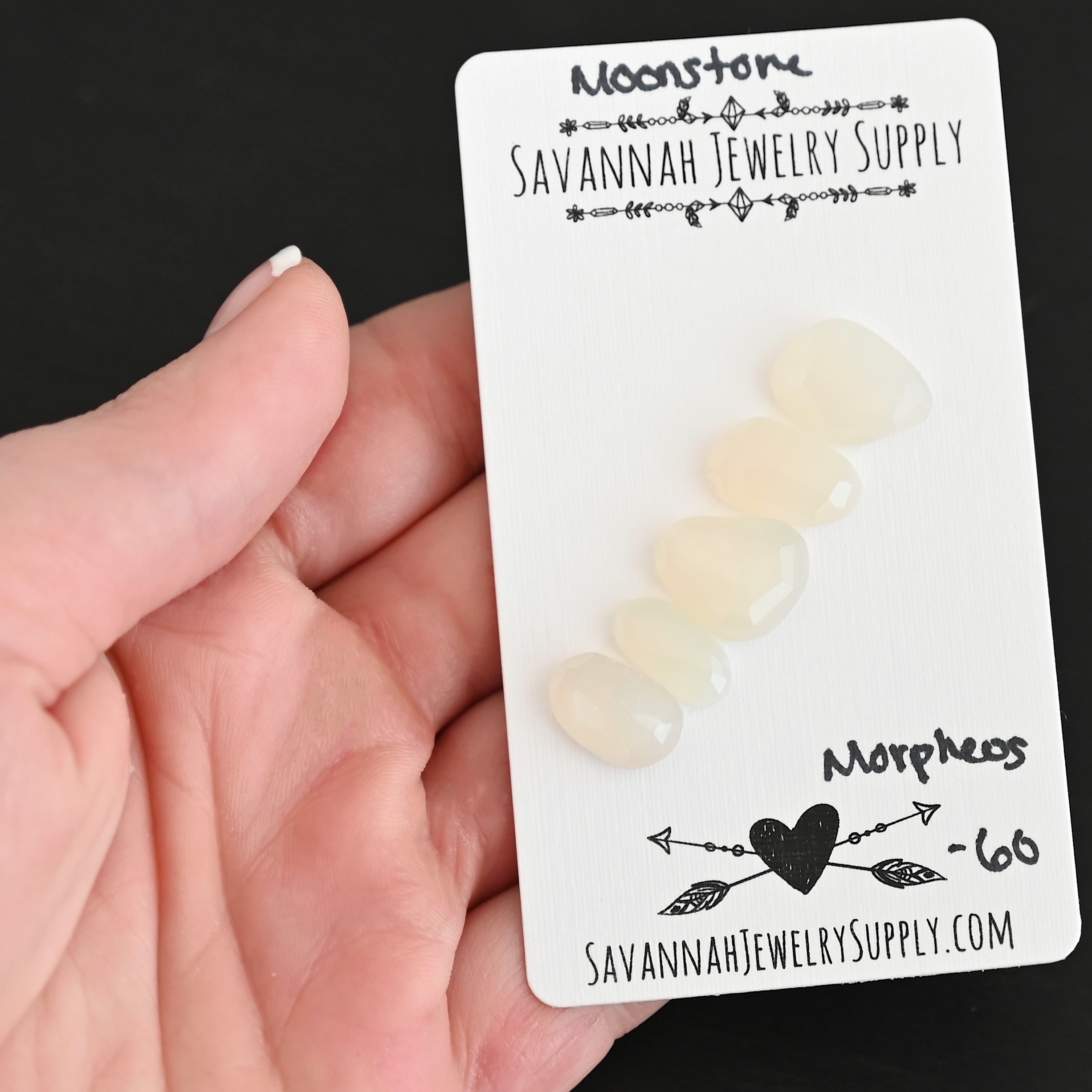 Morpheus Rose Cut Moonstone Cabochon Parcel shown in hand