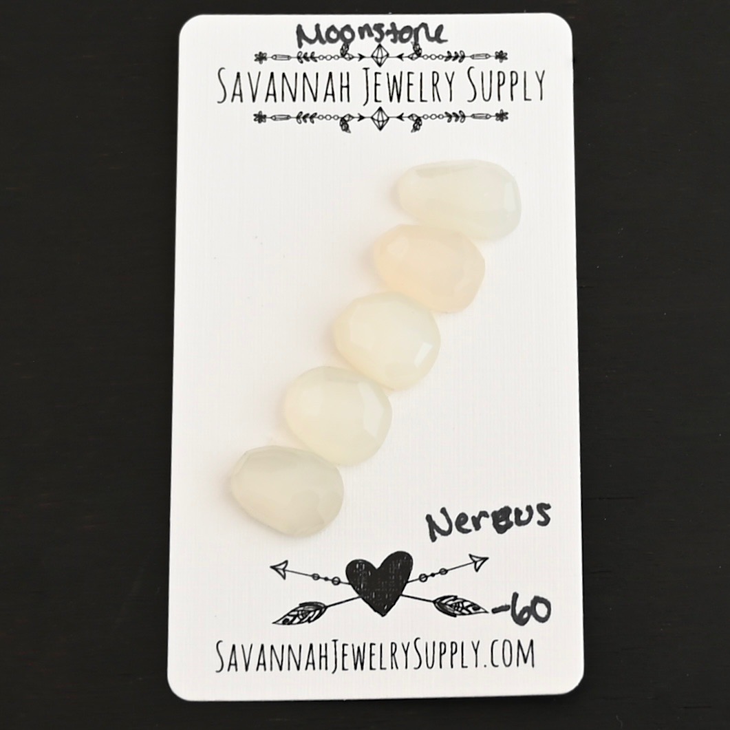 Nereus Rose Cut Moonstone Cabochon Parcel shown on business card