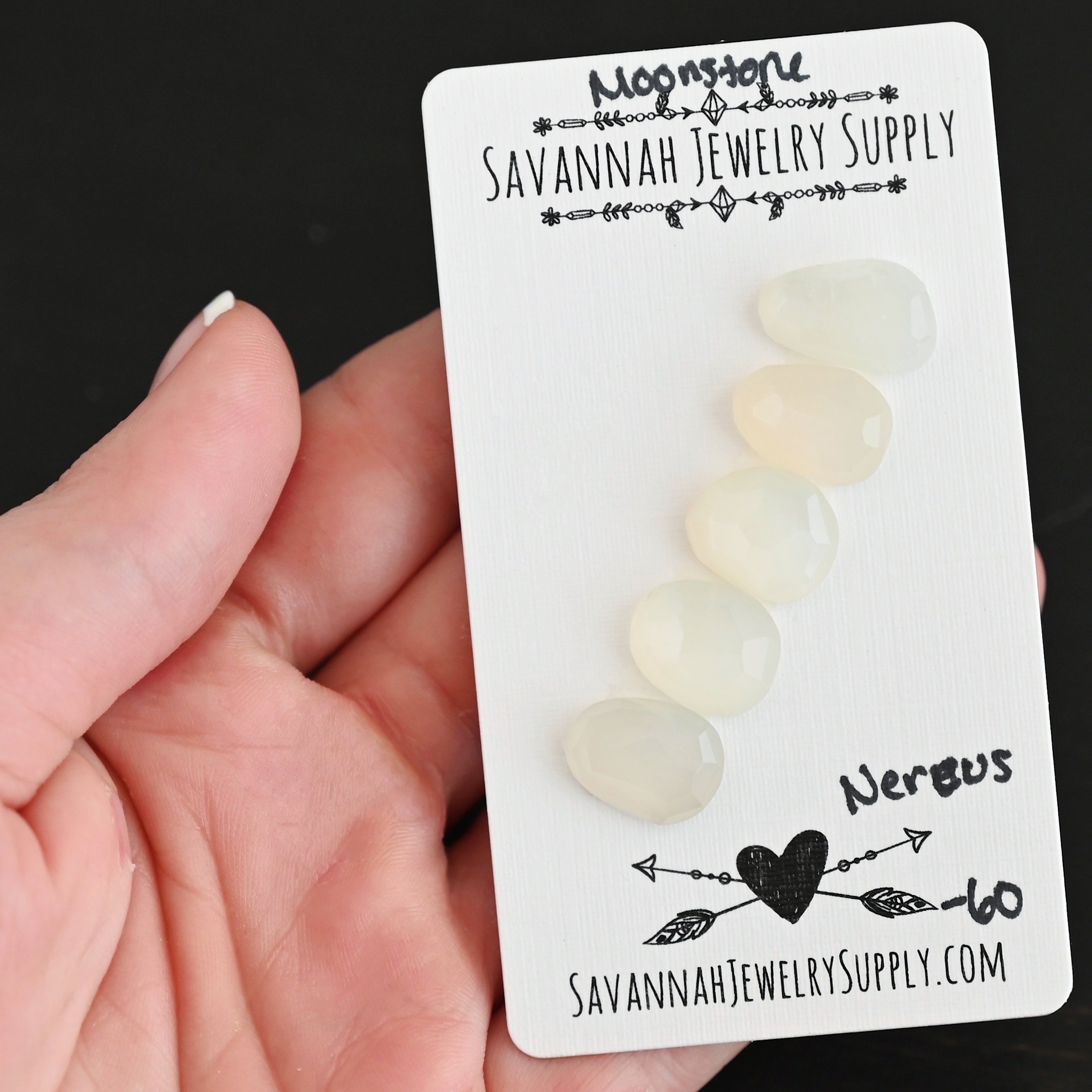 Nereus Rose Cut Moonstone Cabochon Parcel shown in hand