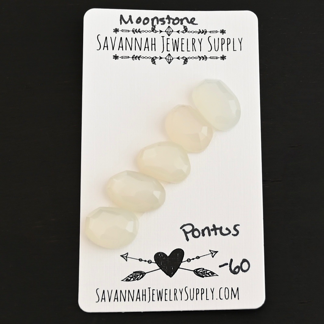 Pontus Rose Cut Moonstone Cabochon Parcel shown on business card